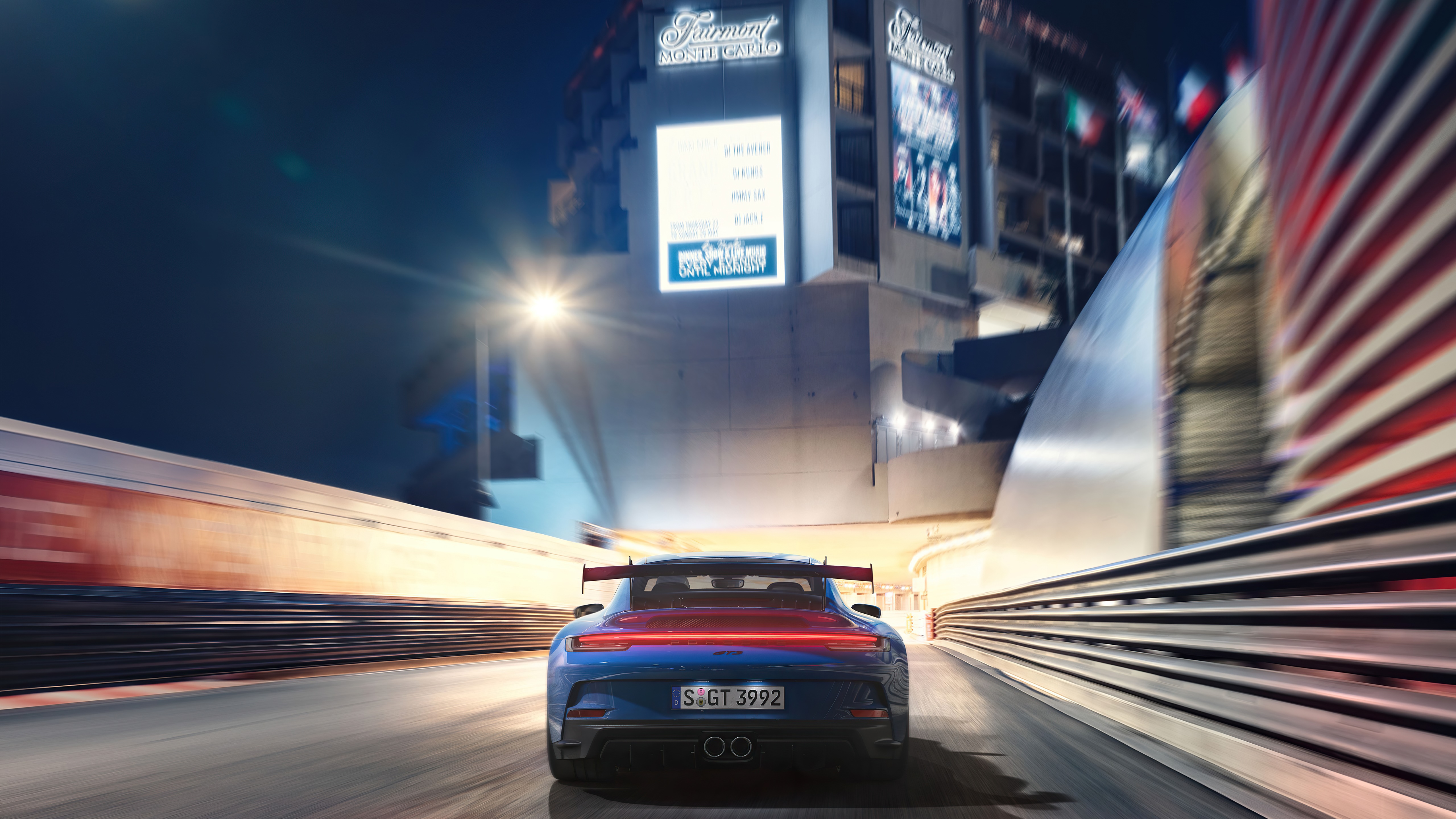 Porsche 911 GT3 driving on a race track at night HD Wallpaper