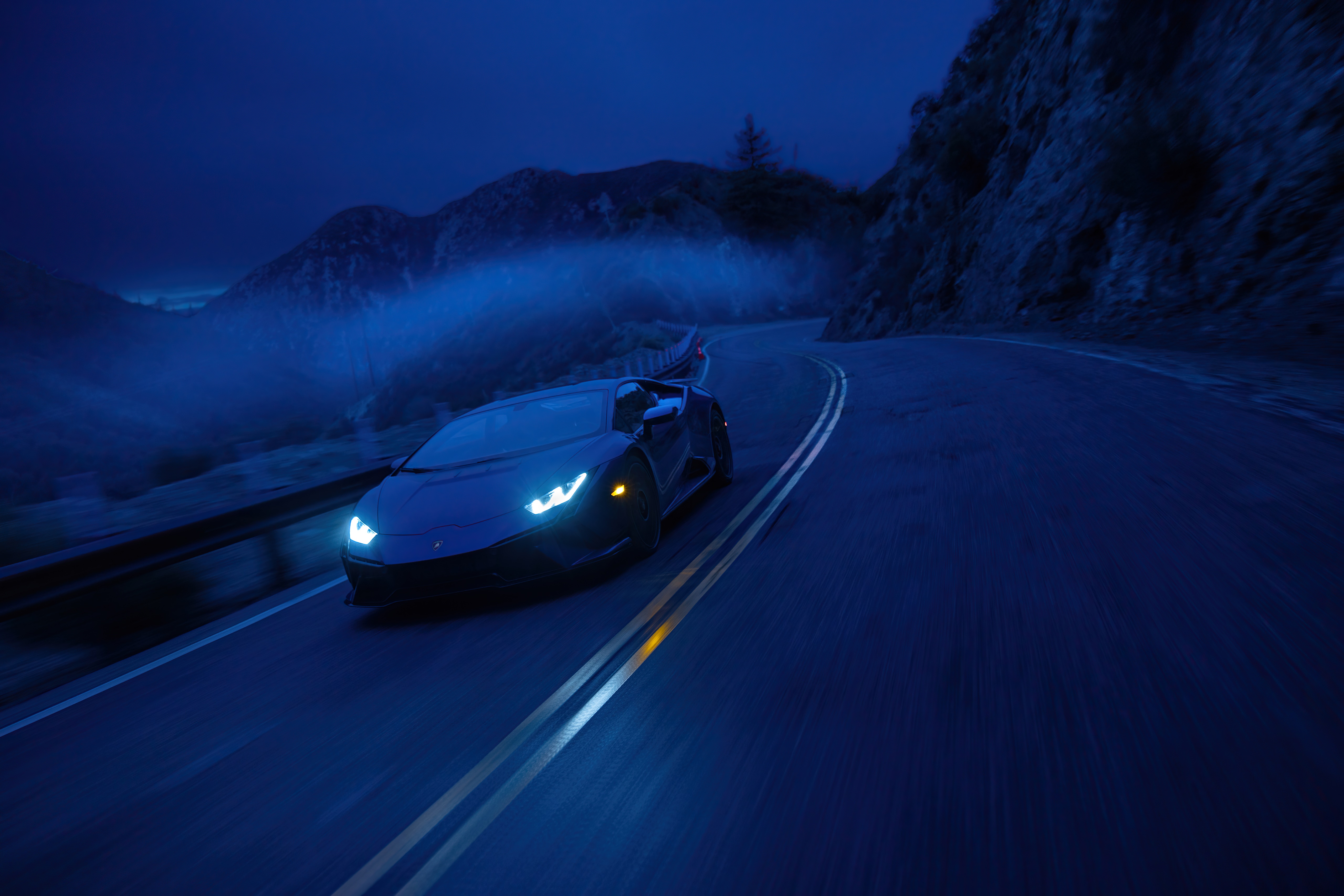 Lamborghini Aventador driving on a mountain road at night HD Wallpaper