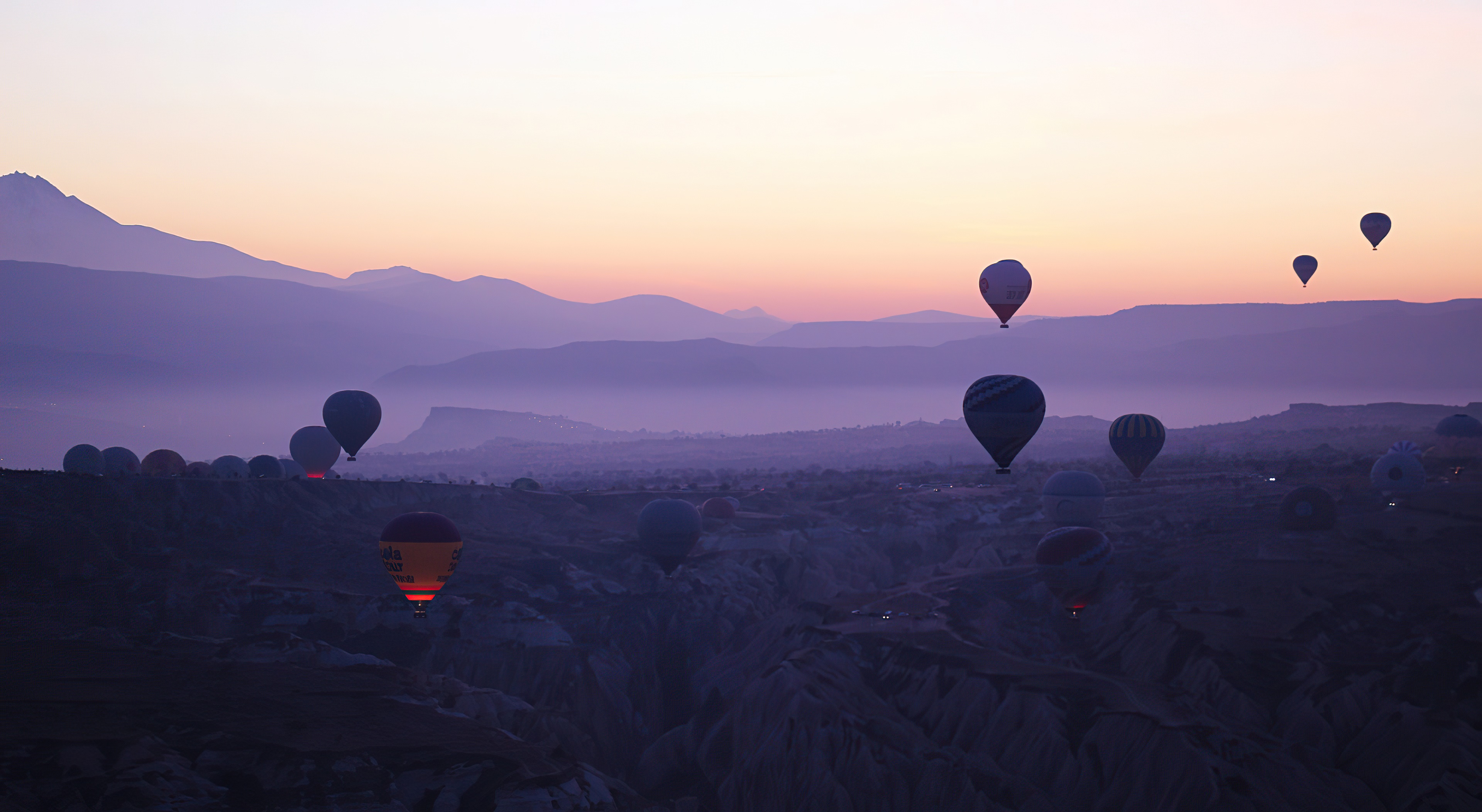 Hot air balloons over Cappadocia at sunset 4K HD Wallpaper