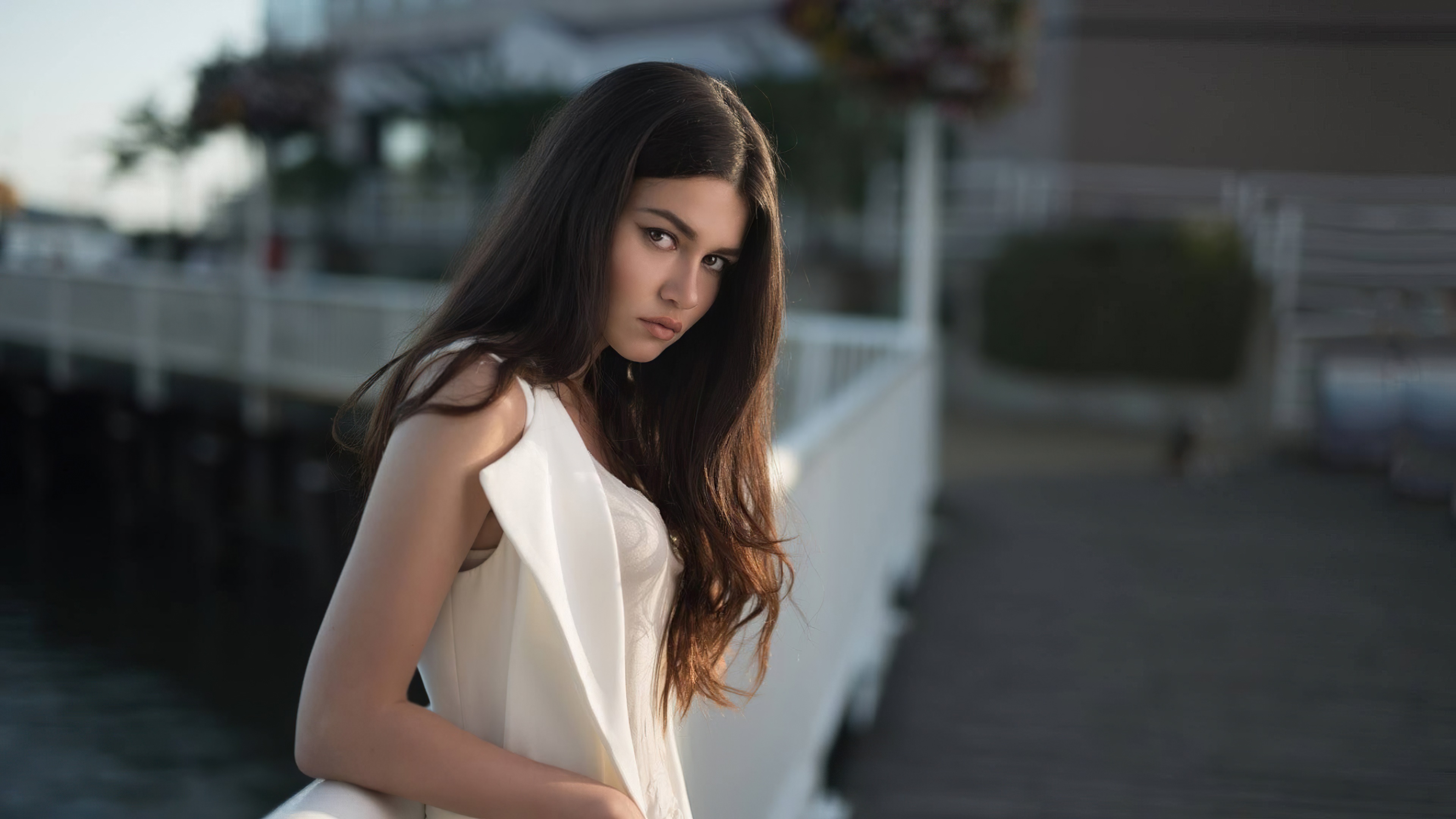 Model in white dress on a boardwalk HD Wallpaper