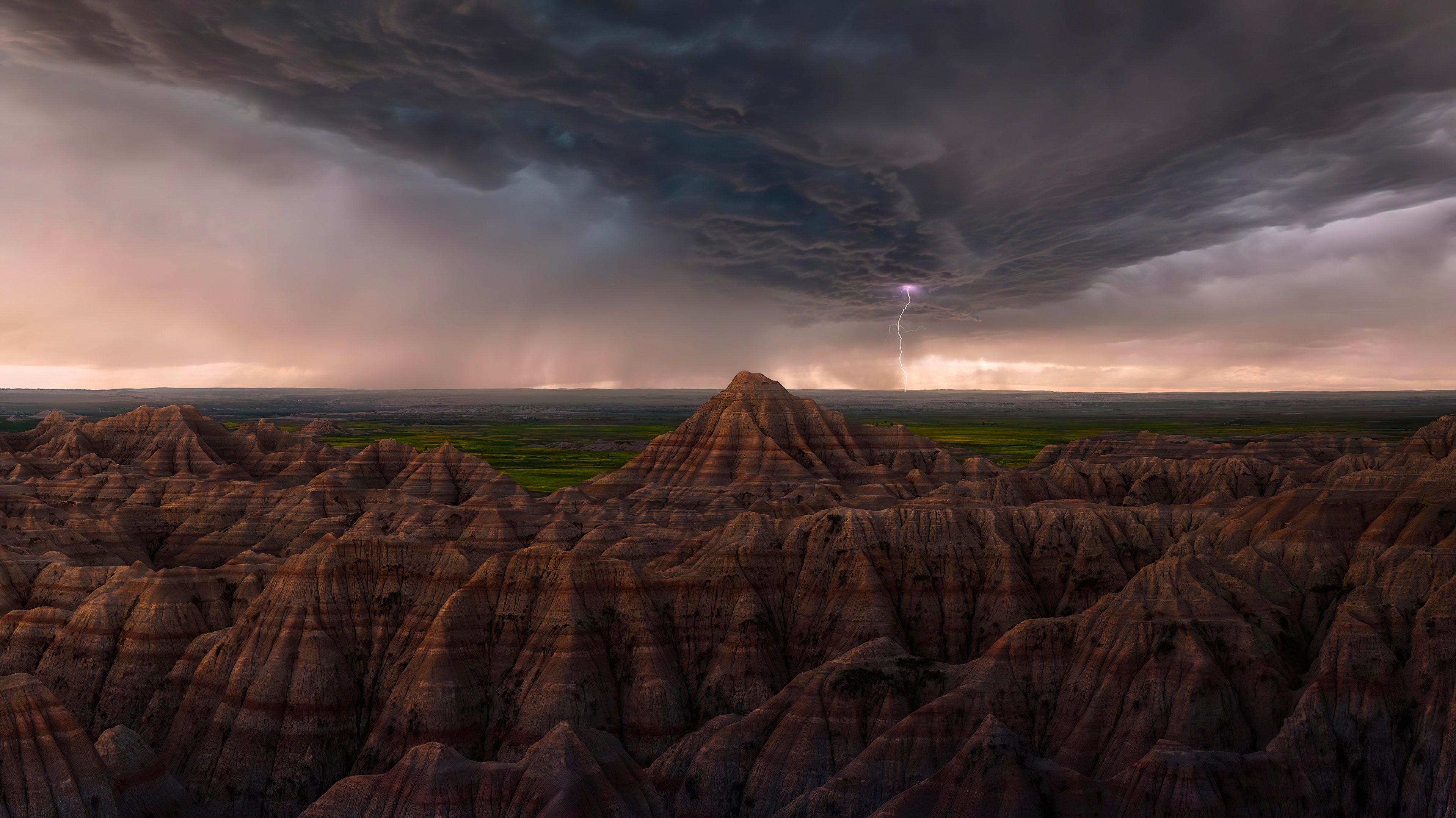 Thunderstorm with lightning over Badlands National Park HD Wallpaper