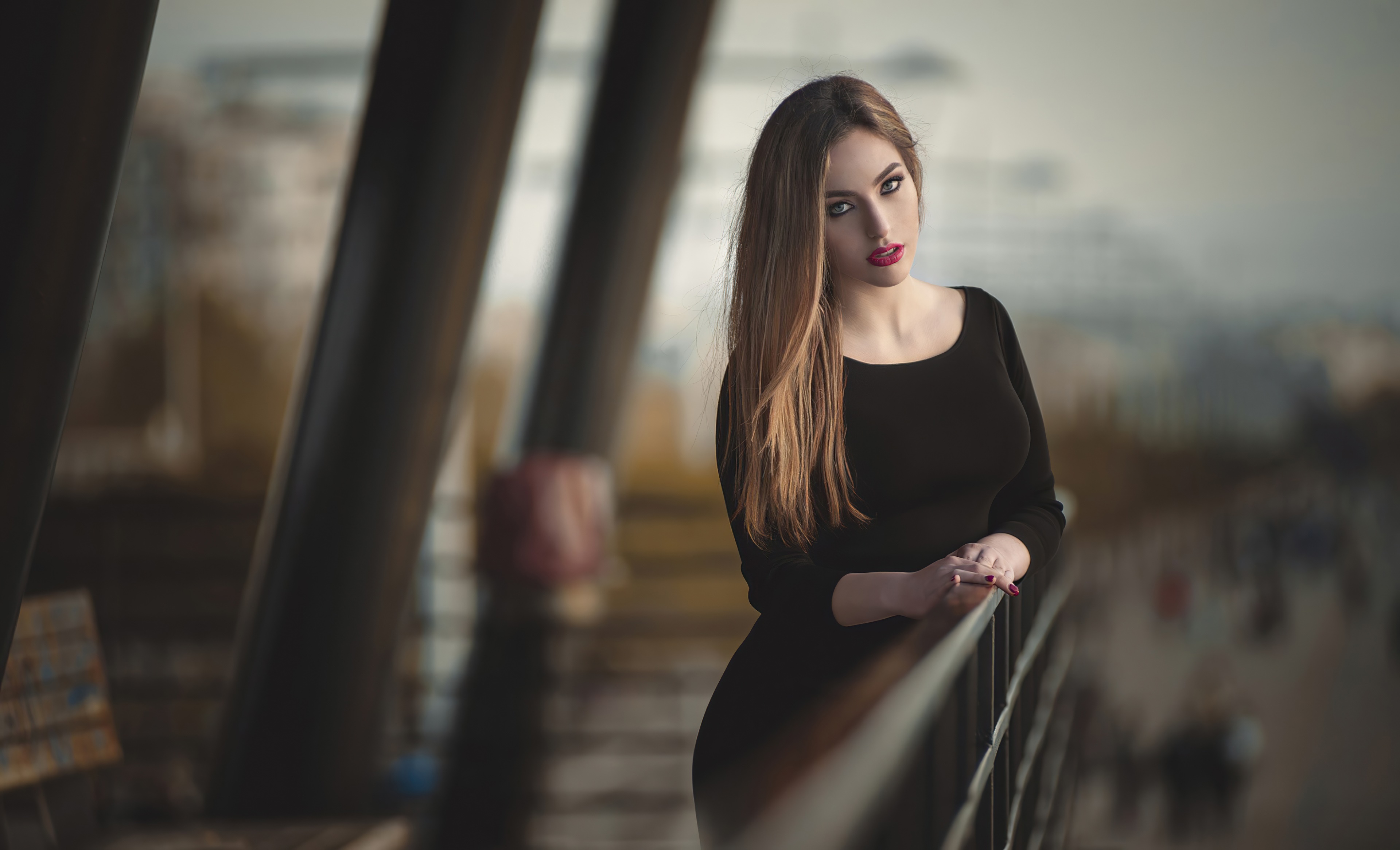 Woman in black dress on balcony HD Wallpaper
