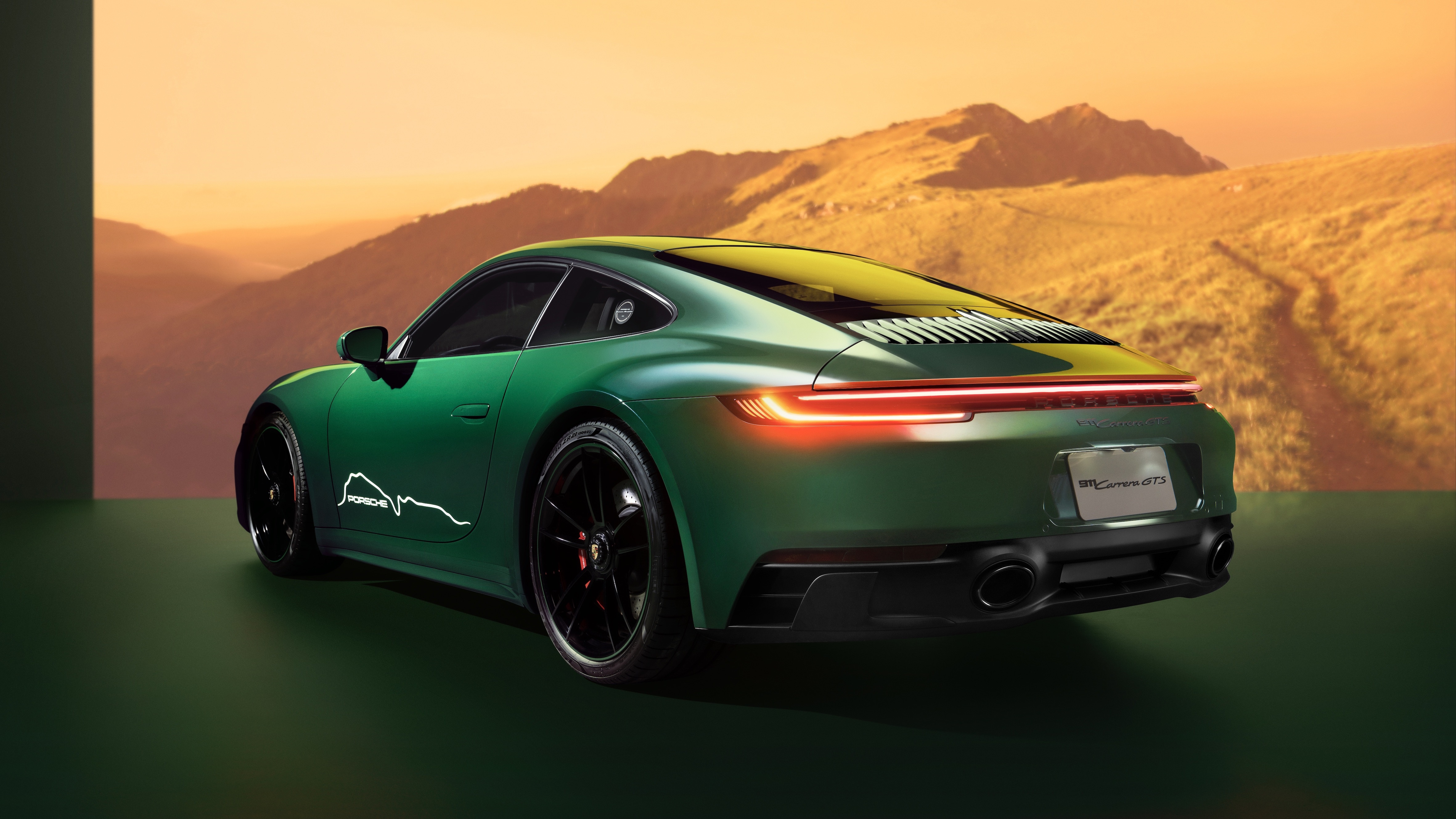 Green Porsche 911 Carrera GTS in mountains HD Wallpaper