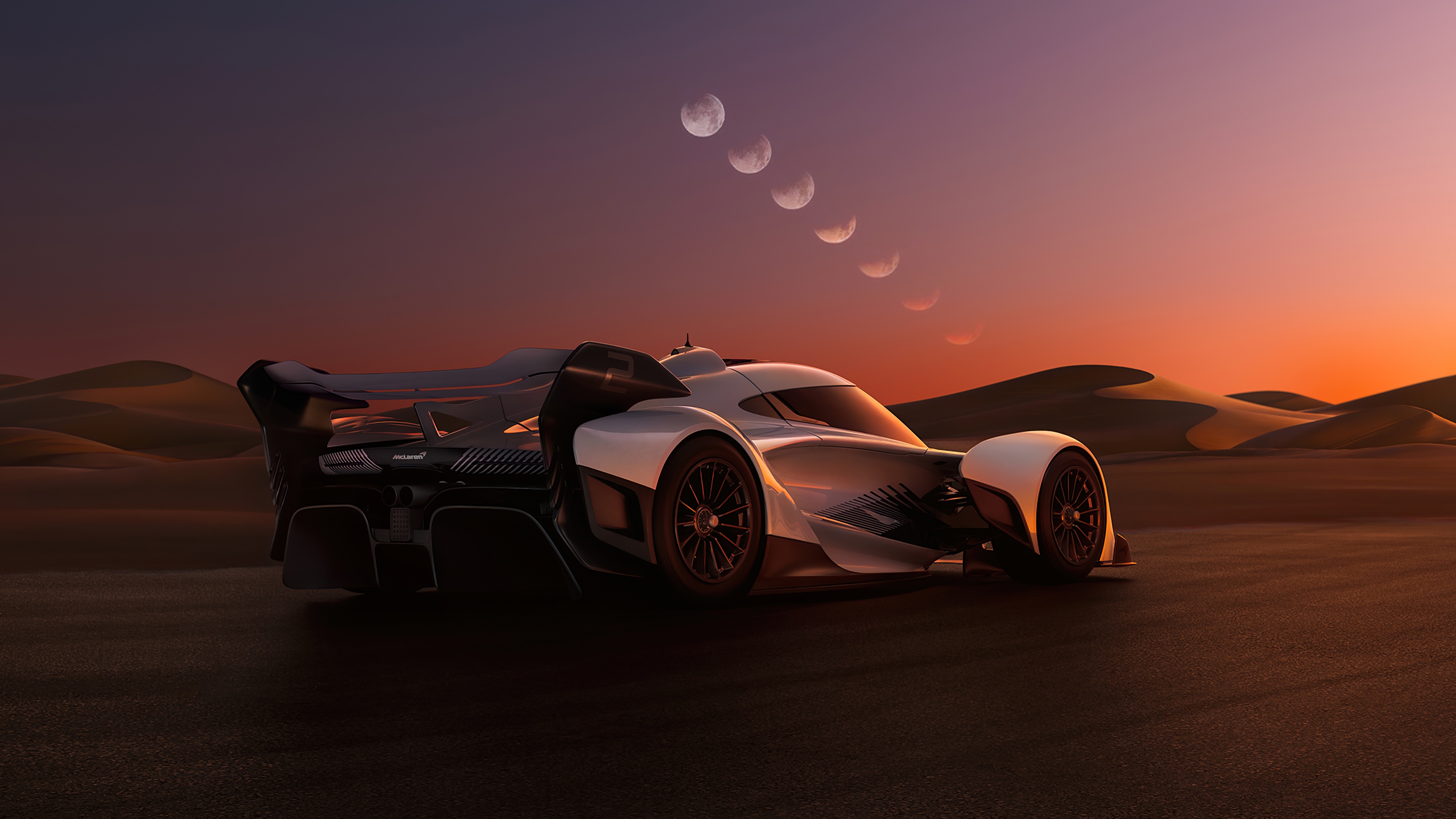 McLaren Solus GT in desert at sunset with moon phases HD Wallpaper