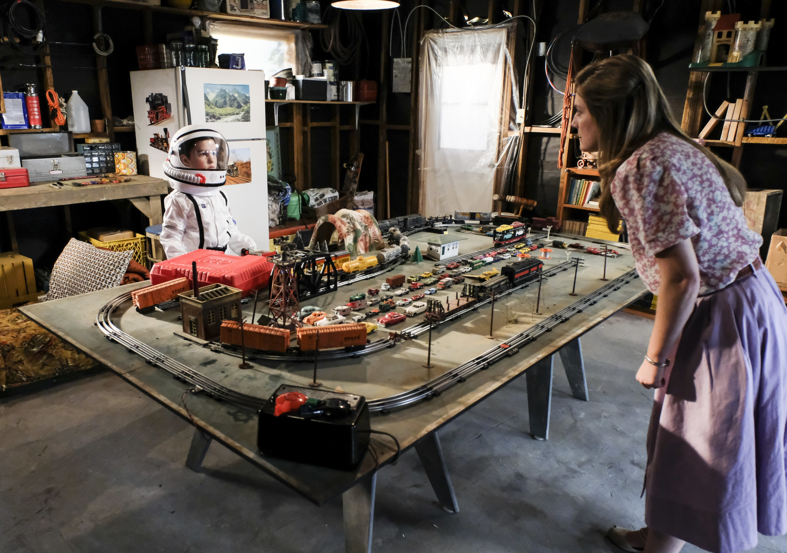 Young Sheldon and Mary Cooper with model train set HD Wallpaper