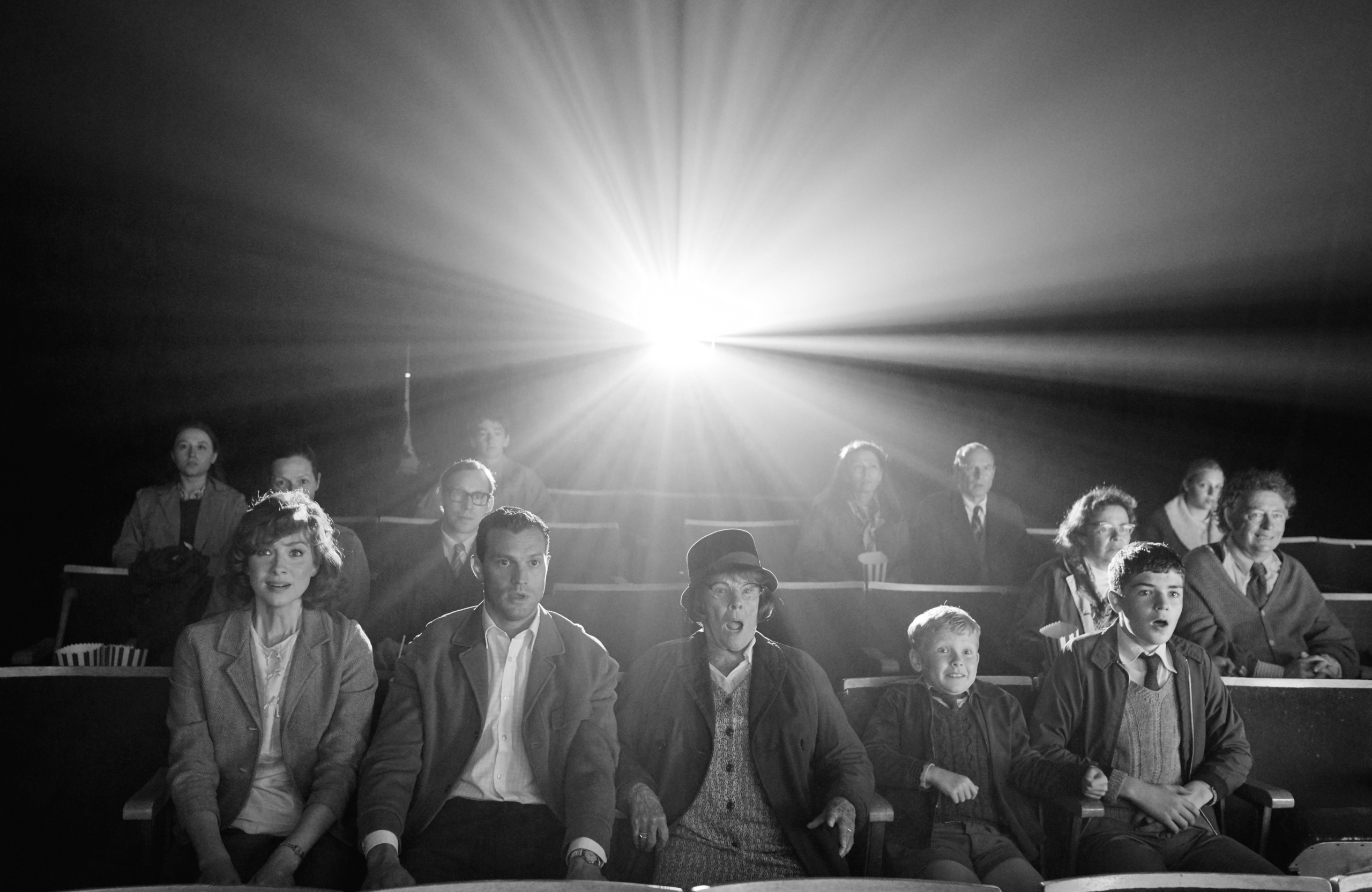 Belfast movie audience captivated in a black and white cinema HD Wallpaper