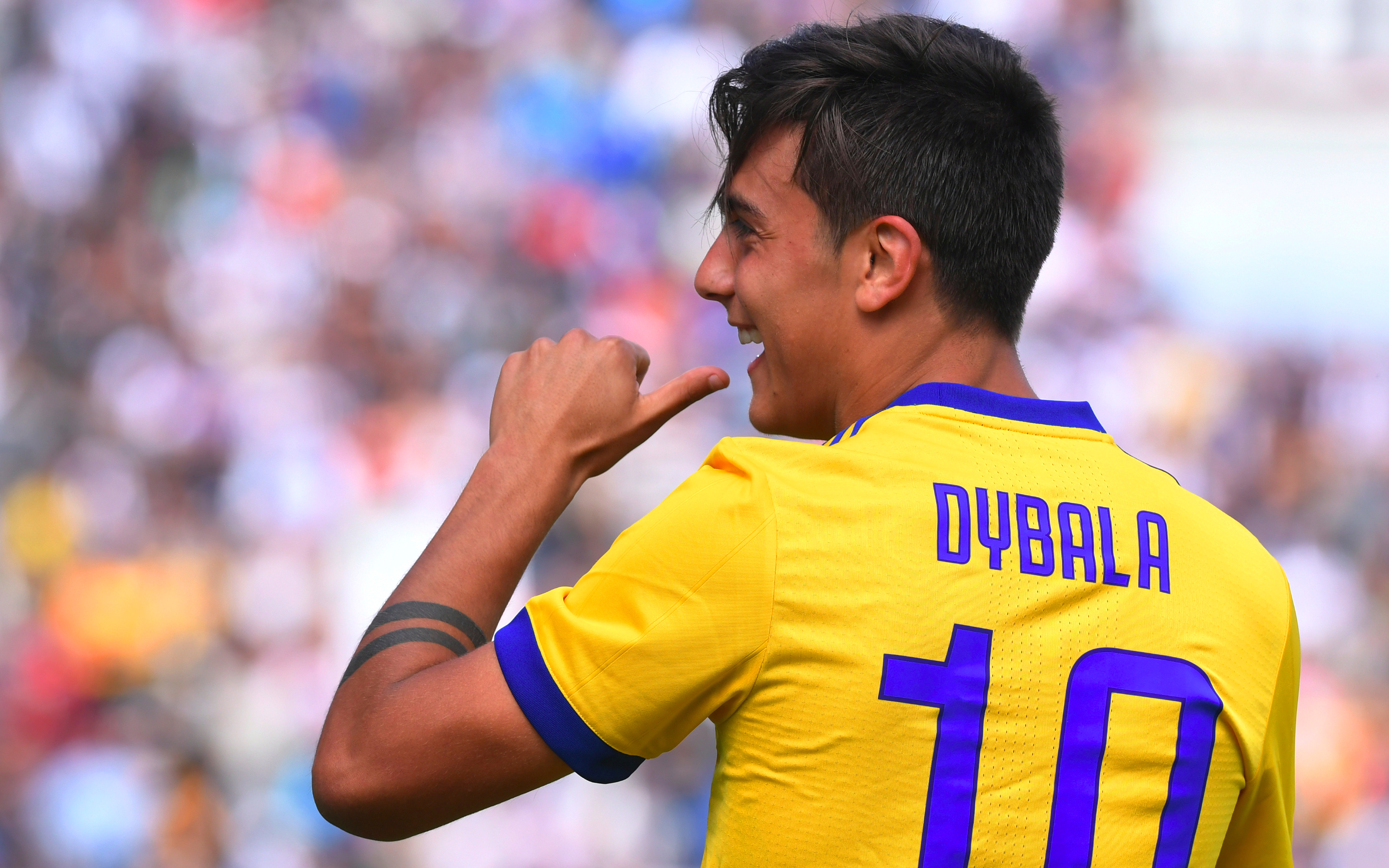 Paulo Dybala celebrates in yellow Juventus F.C. kit 4K HD Wallpaper
