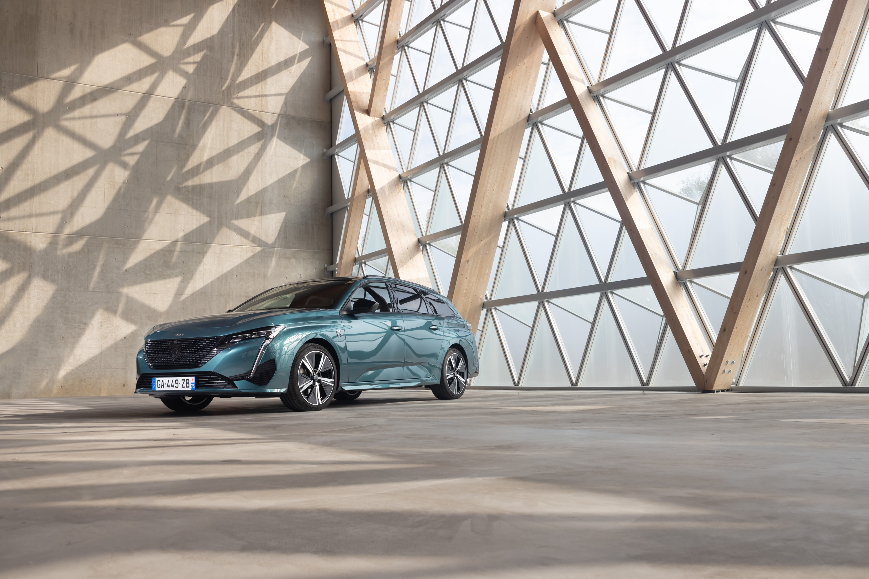 Peugeot 308 SW Hybrid in modern geometric architecture HD Wallpaper