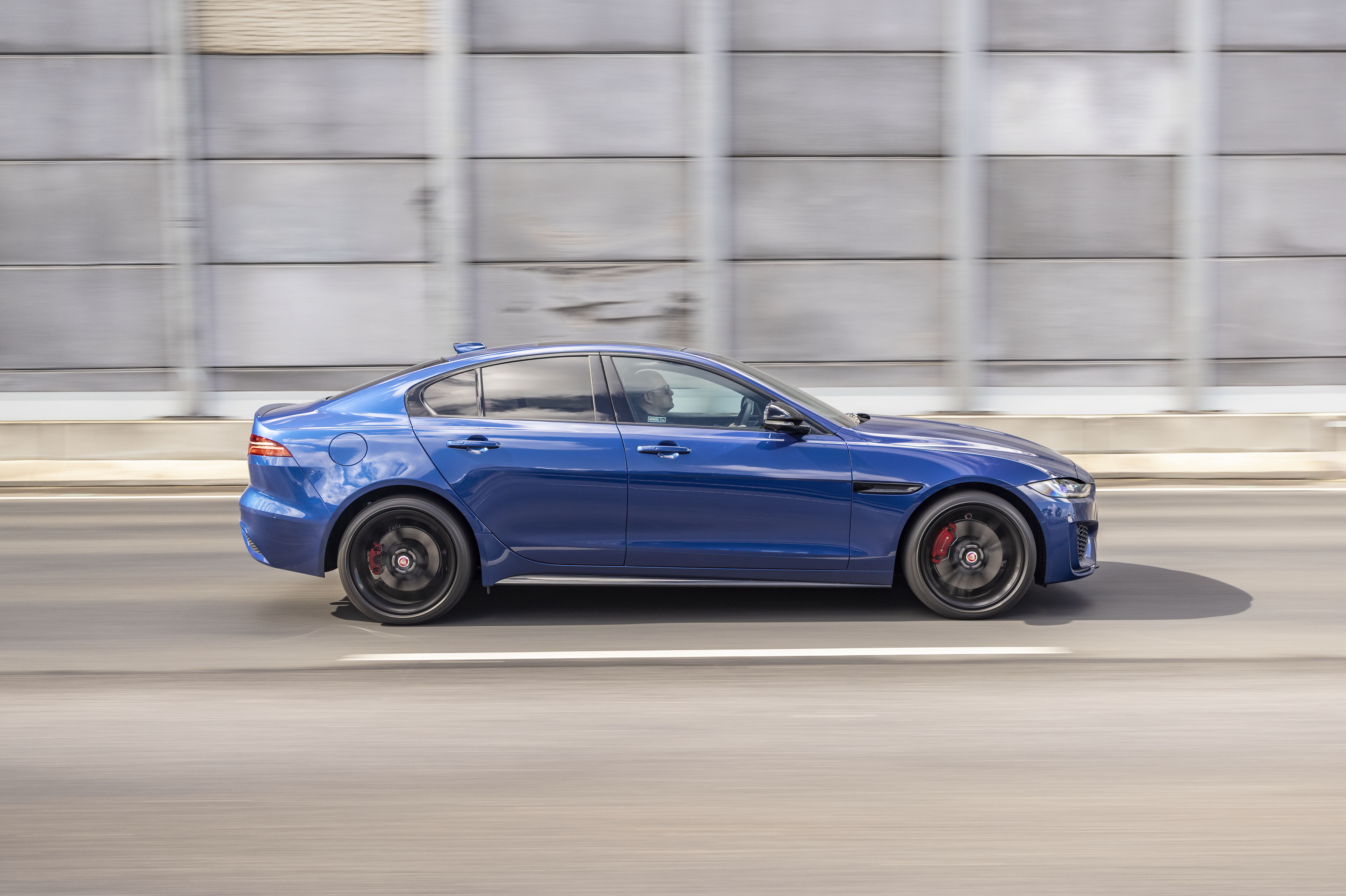 Moving Blue Jaguar XE P300 AWD Luxury Car HD Wallpaper