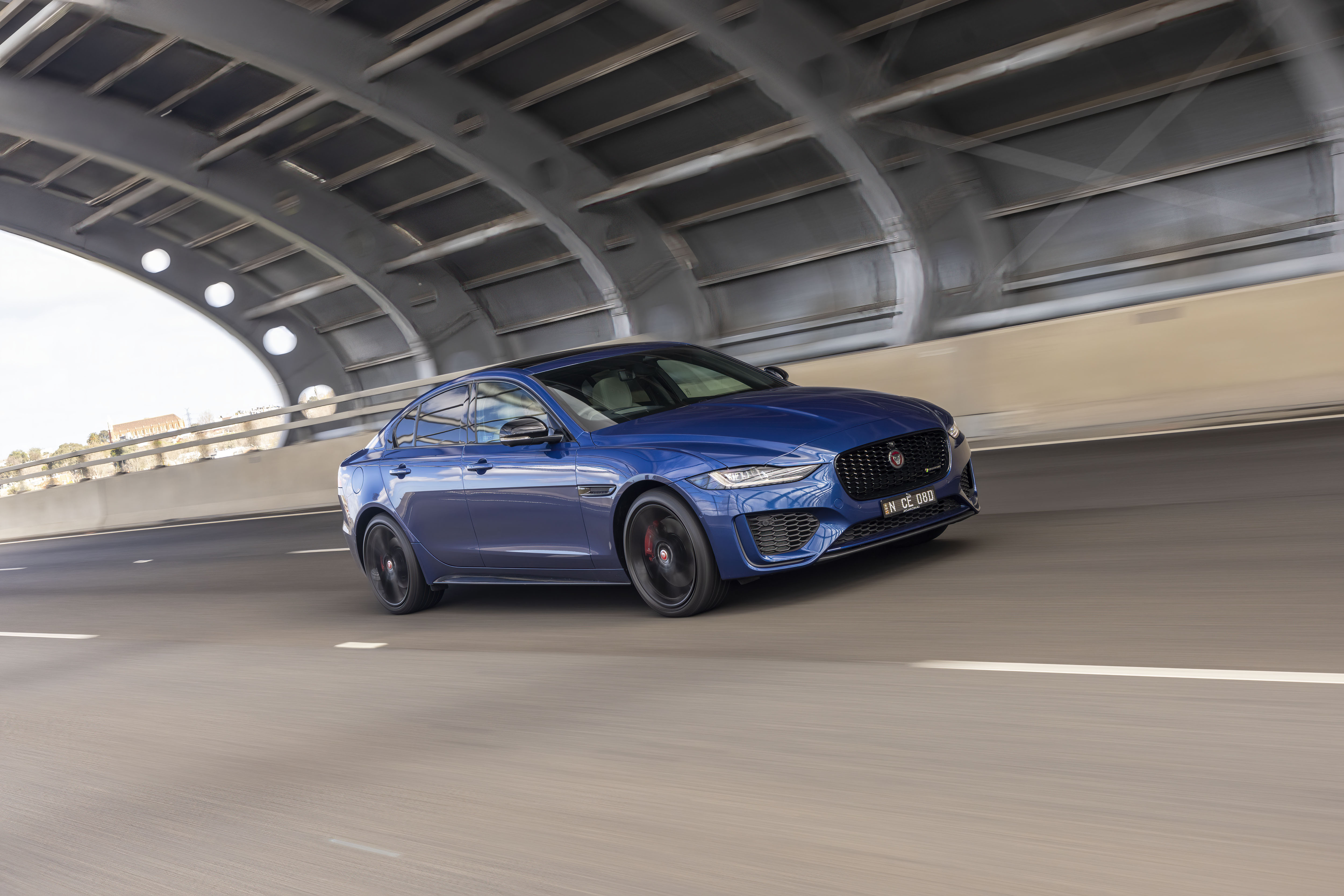 Blue Jaguar XE P300 AWD luxury car driving HD Wallpaper