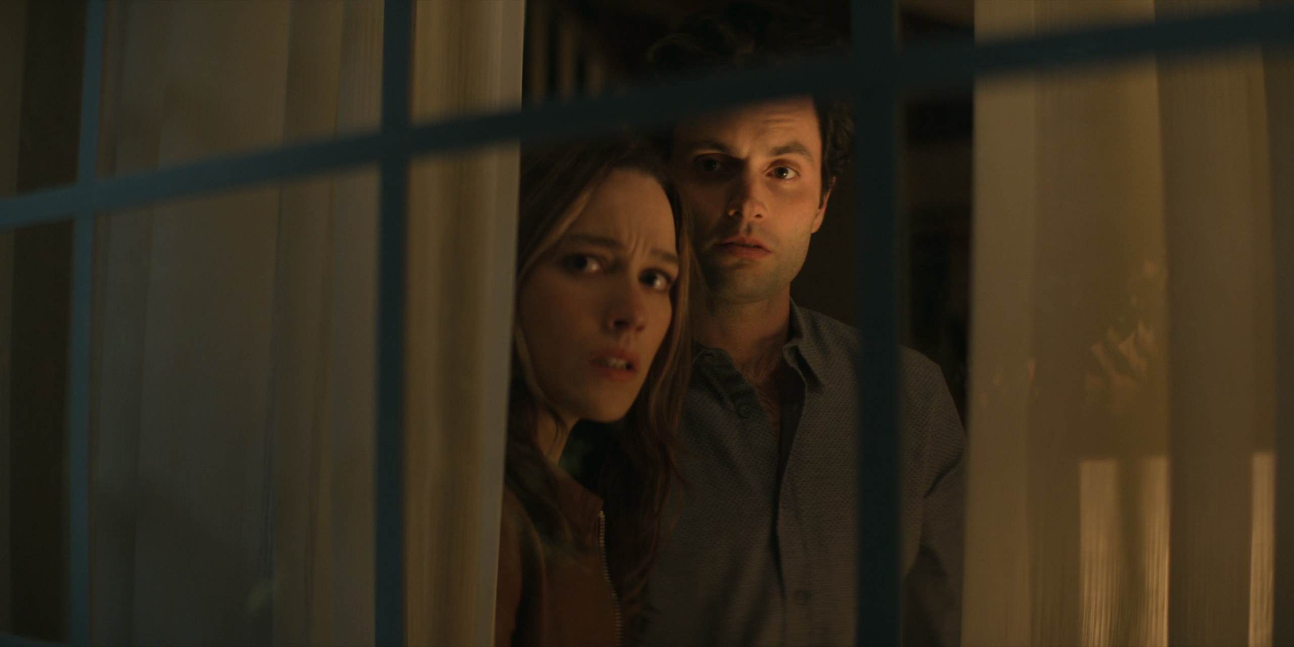 Penn Badgley and Victoria Pedretti looking scared in YOU HD Wallpaper