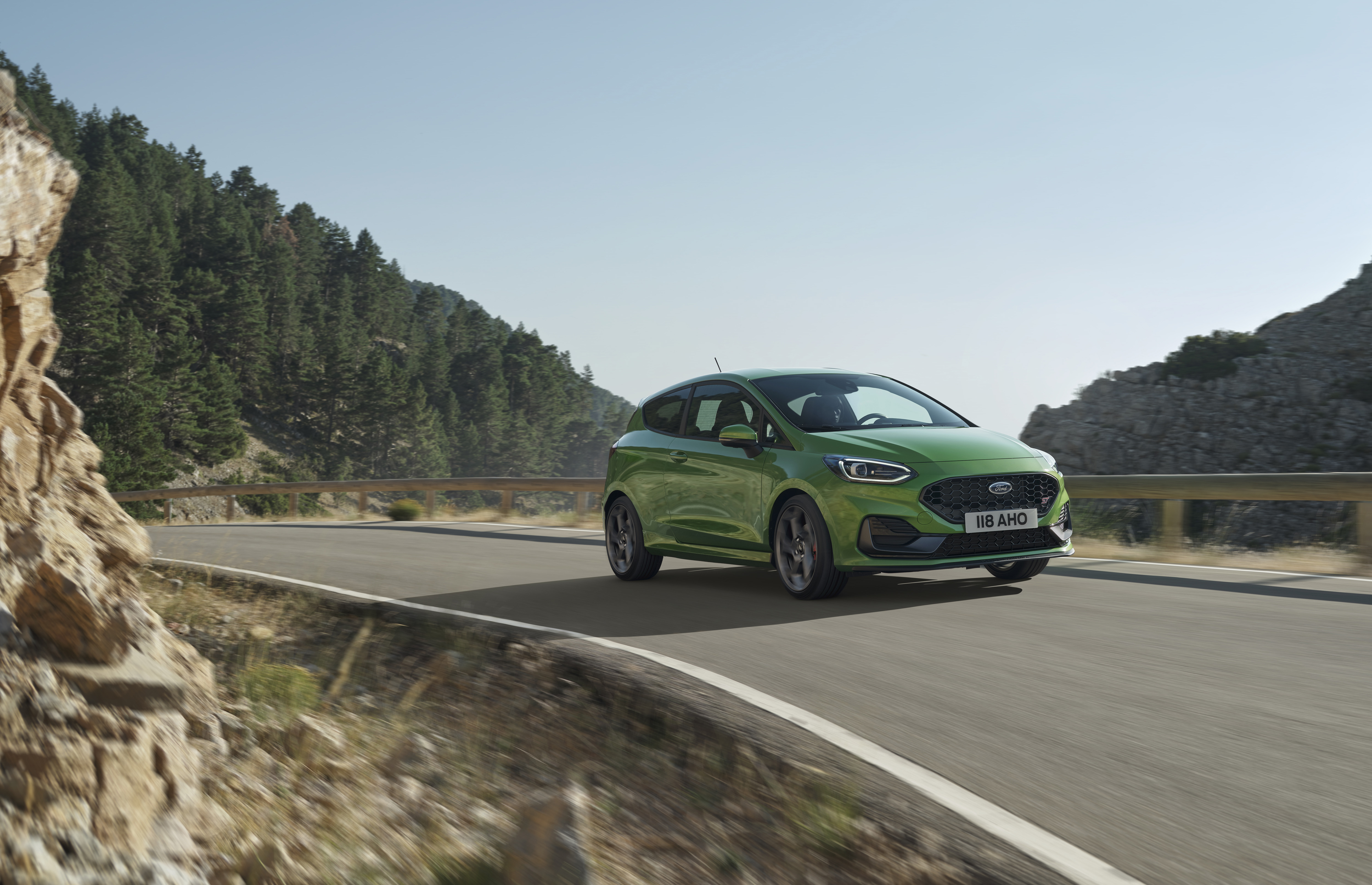 Green Ford Fiesta ST 4K on mountain road HD Wallpaper
