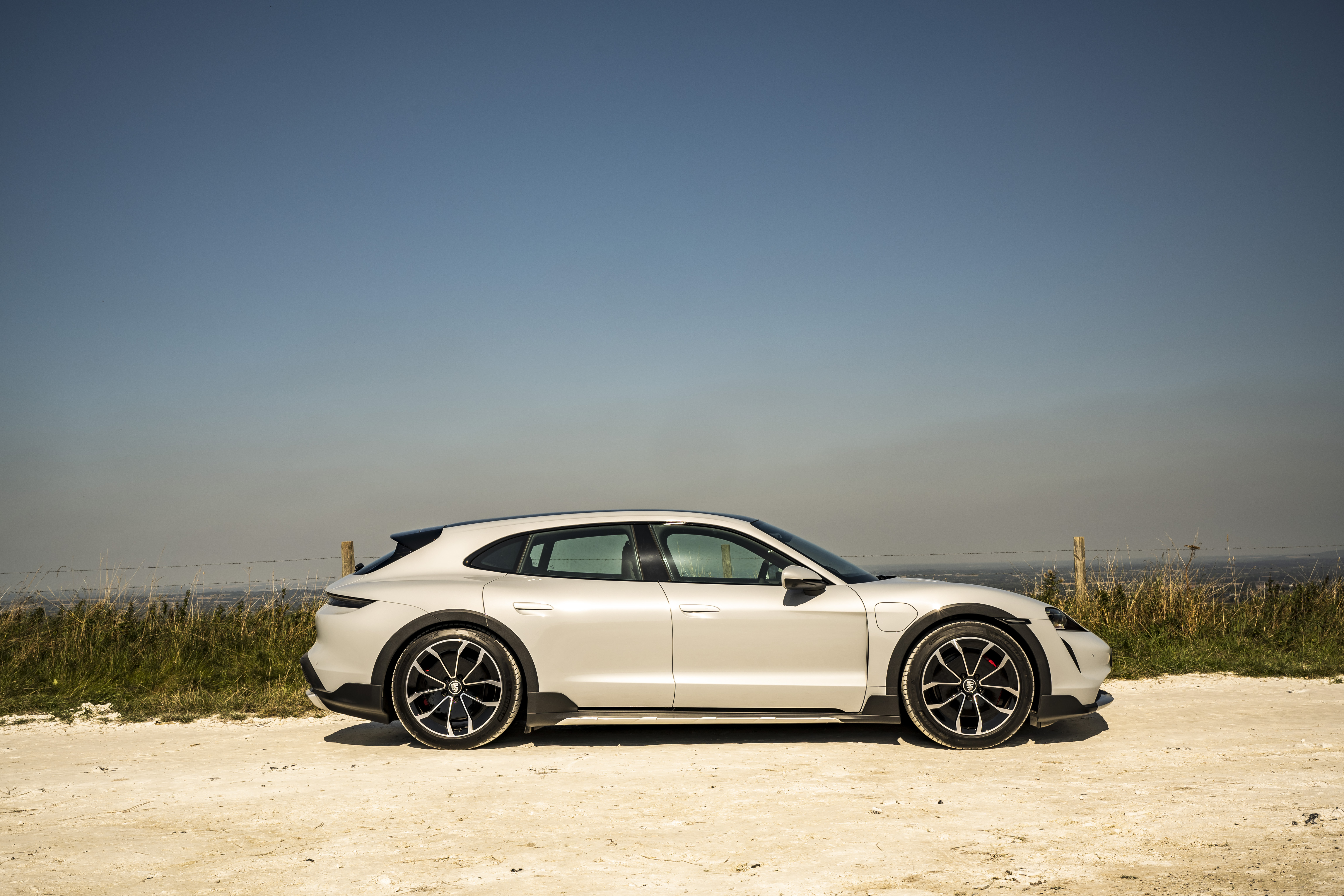 White Porsche Taycan 4S 4K on dirt road HD Wallpaper