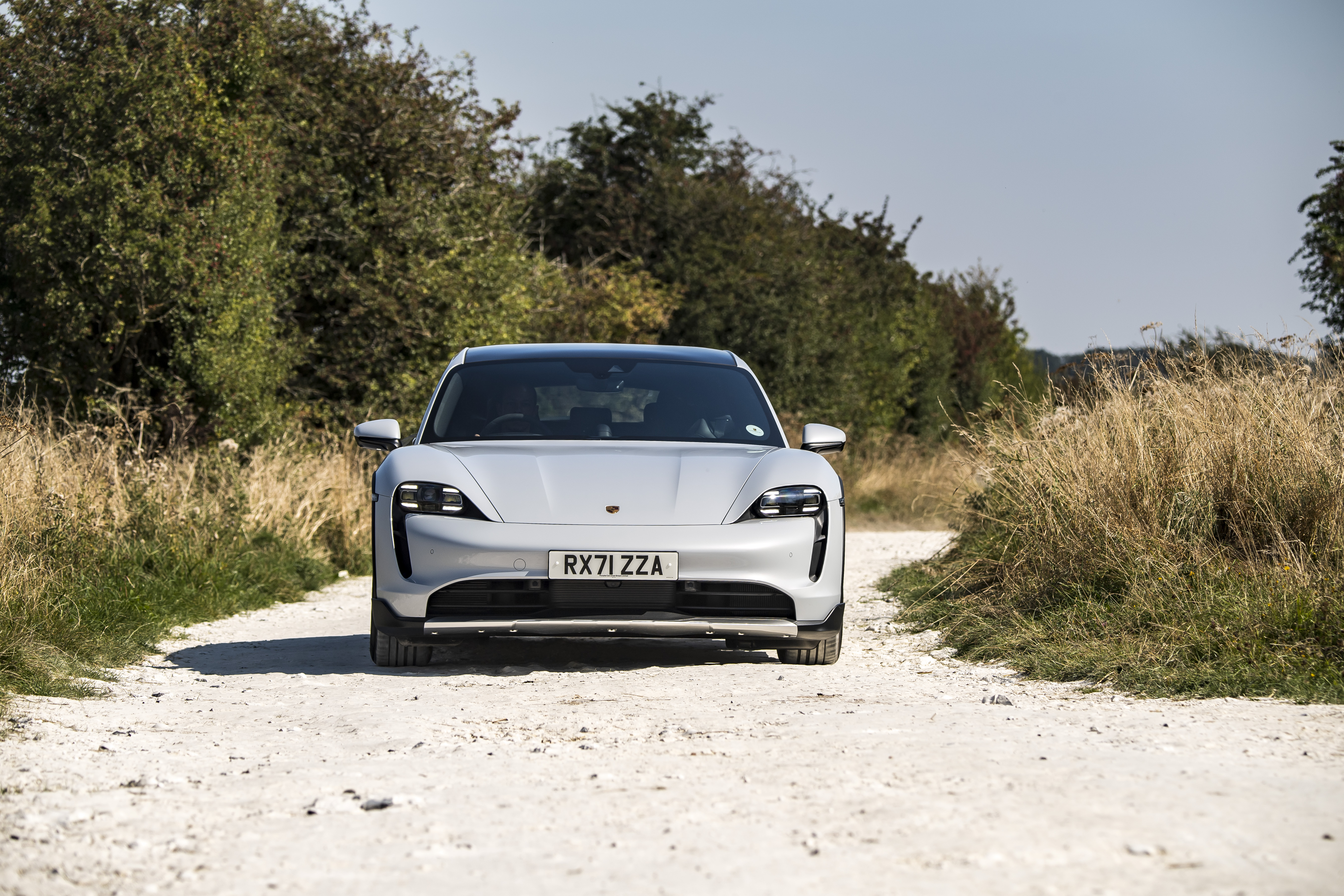 Porsche Taycan 4S: White sport car on a country road HD Wallpaper