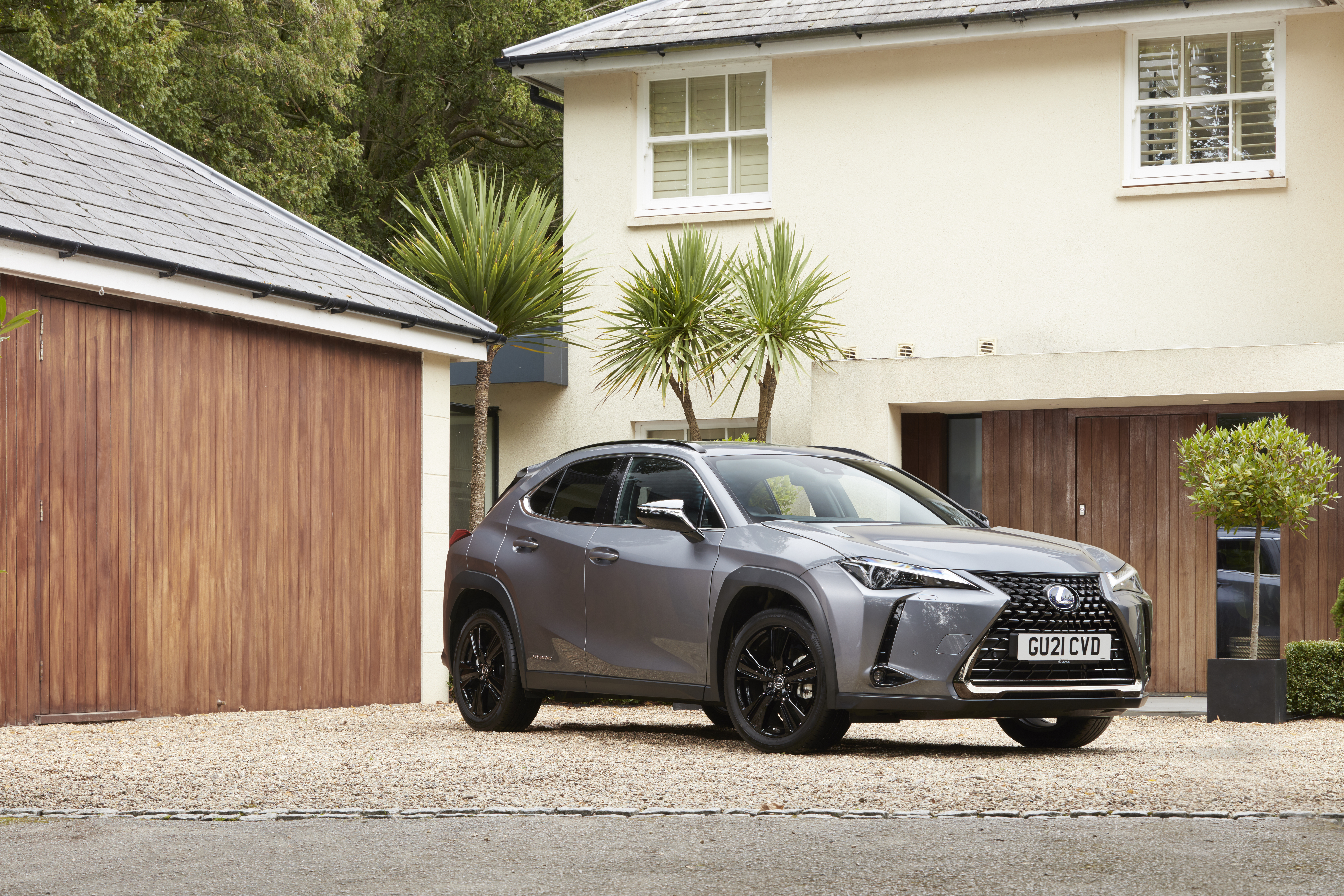 Lexus UX 250H Luxury SUV parked at modern house HD Wallpaper