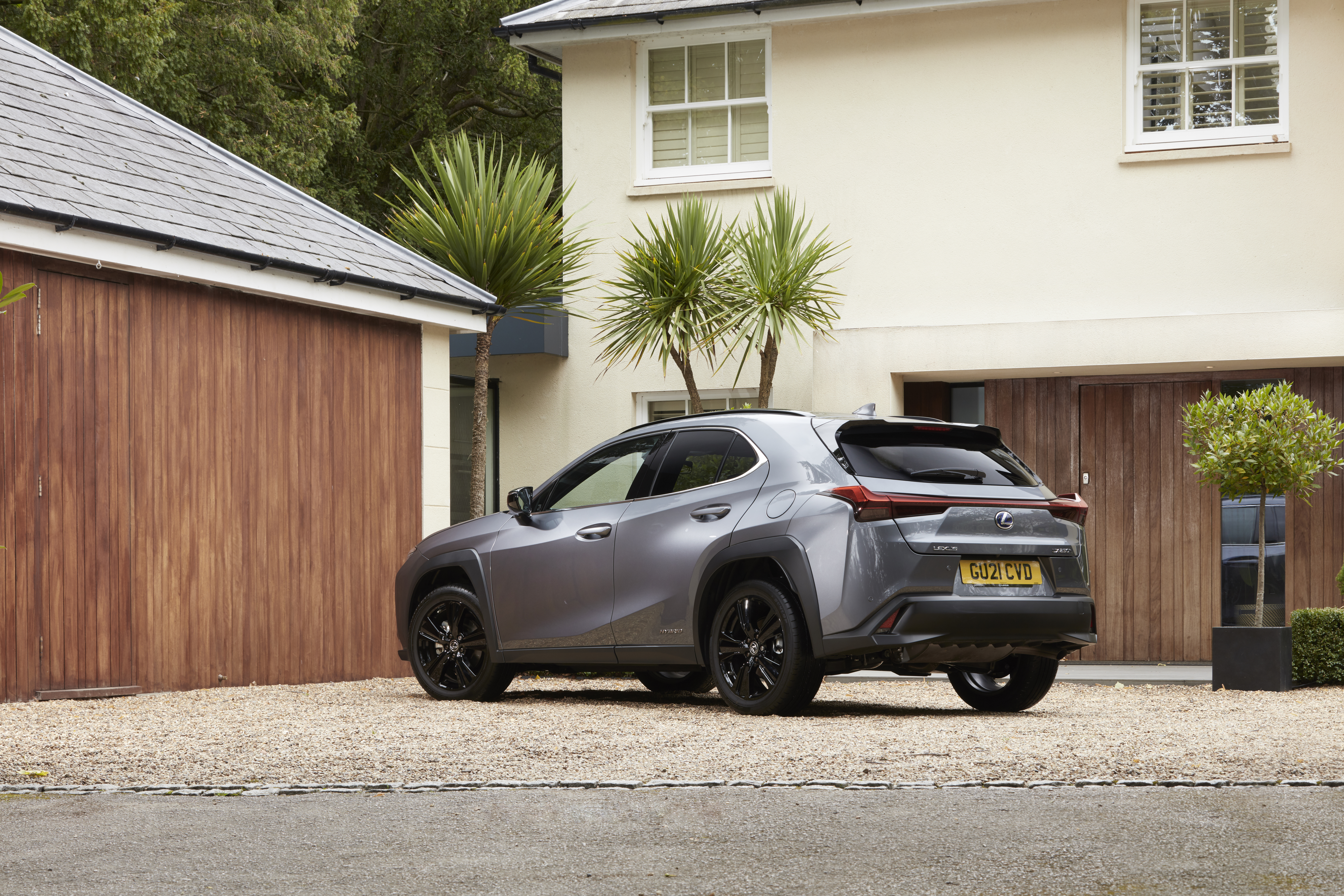 Grey Lexus UX 250H luxury SUV at a house HD Wallpaper