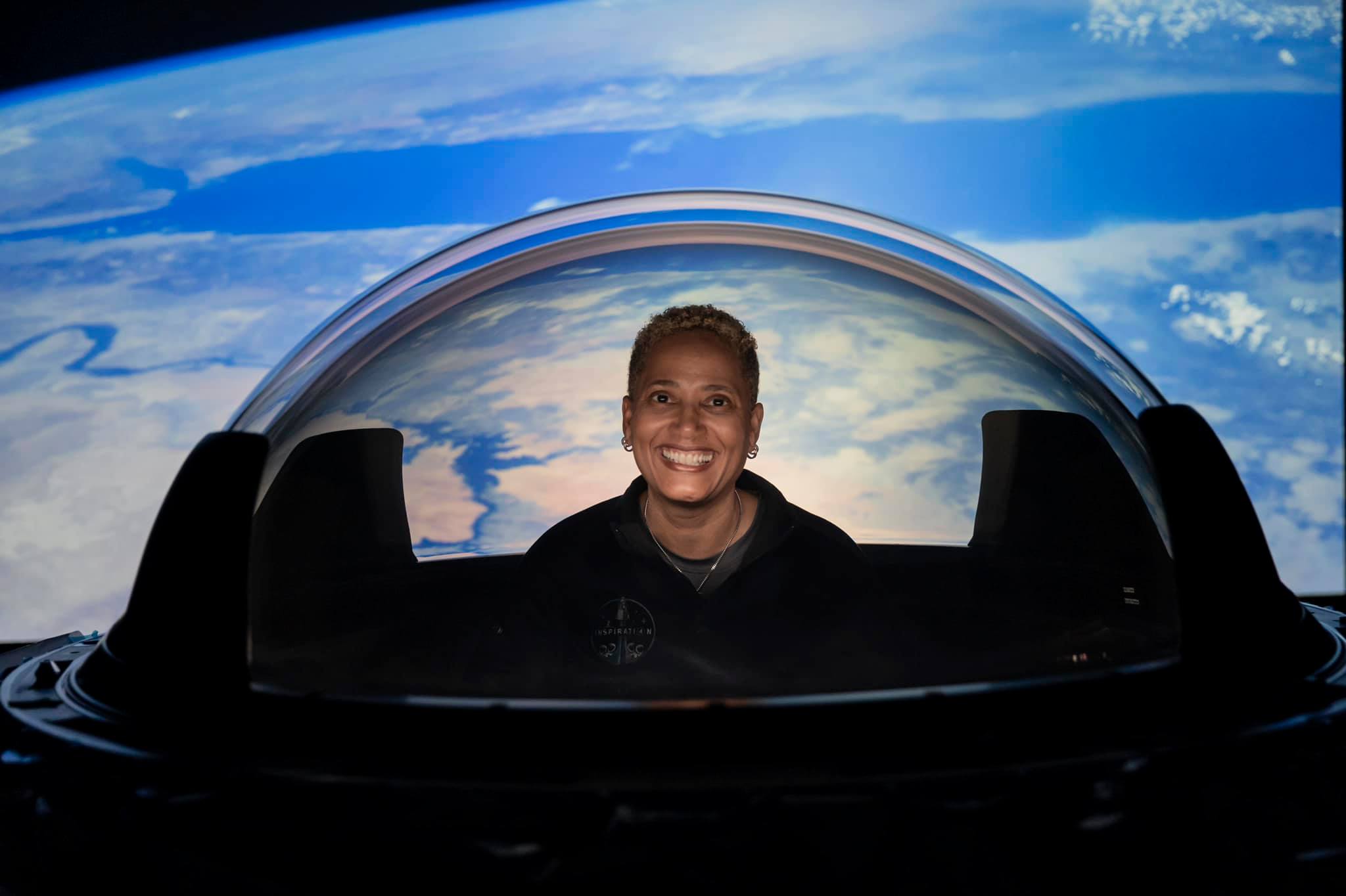 Inspiration4 crew member smiles at Earth from space HD Wallpaper