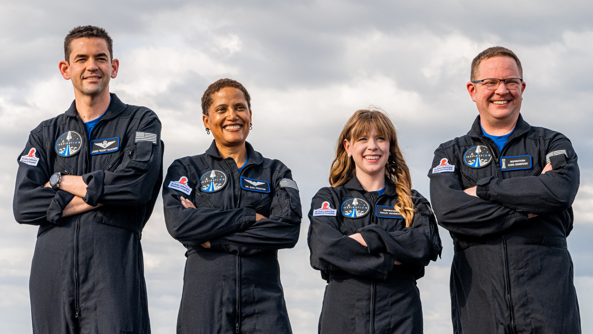 Inspiration4 crew smiling in flight suits HD Wallpaper