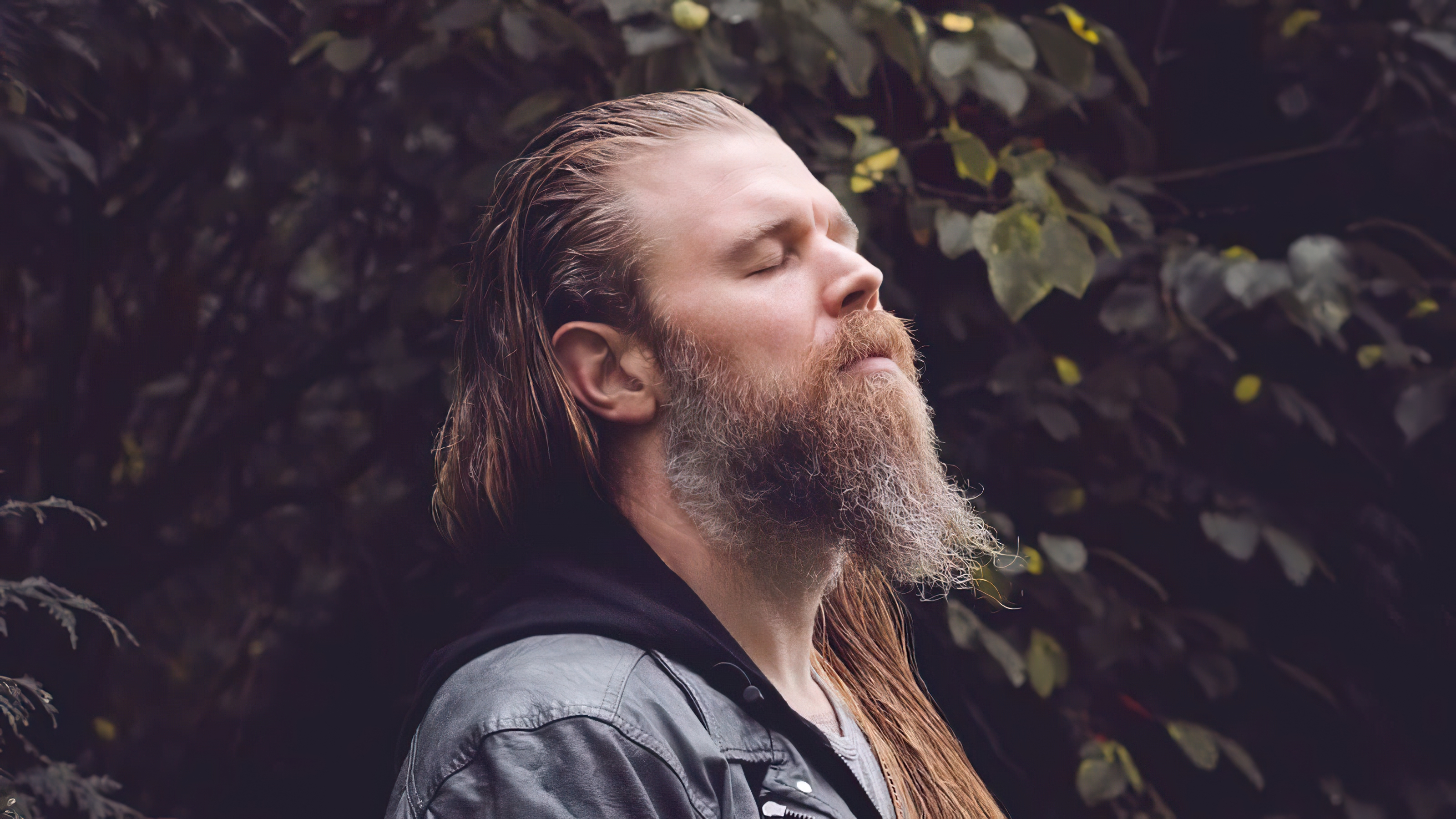 Ryan Hurst in peaceful contemplation outdoors HD Wallpaper
