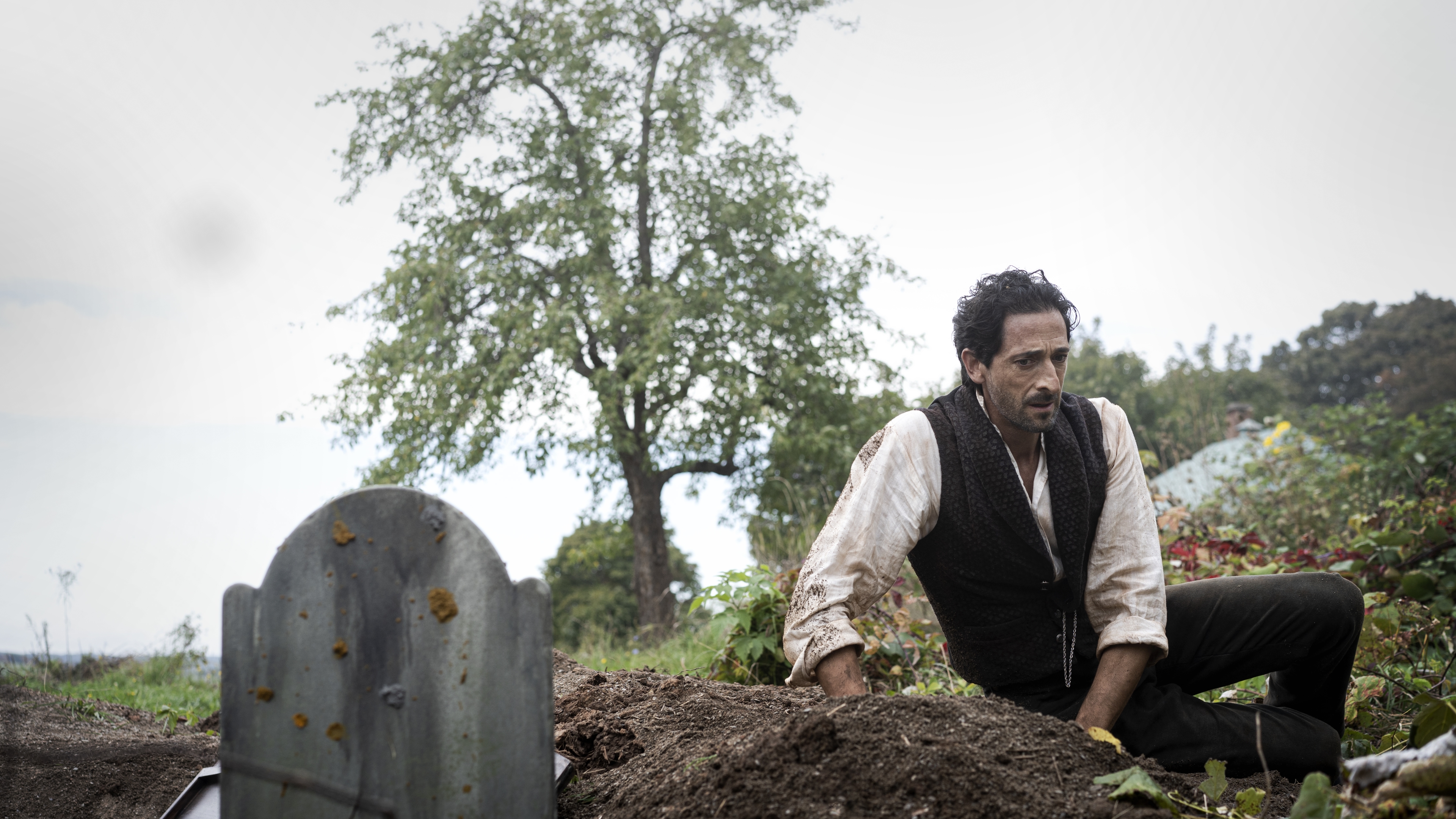 Adrien Brody looking distressed at a grave in Chapelwaite HD Wallpaper