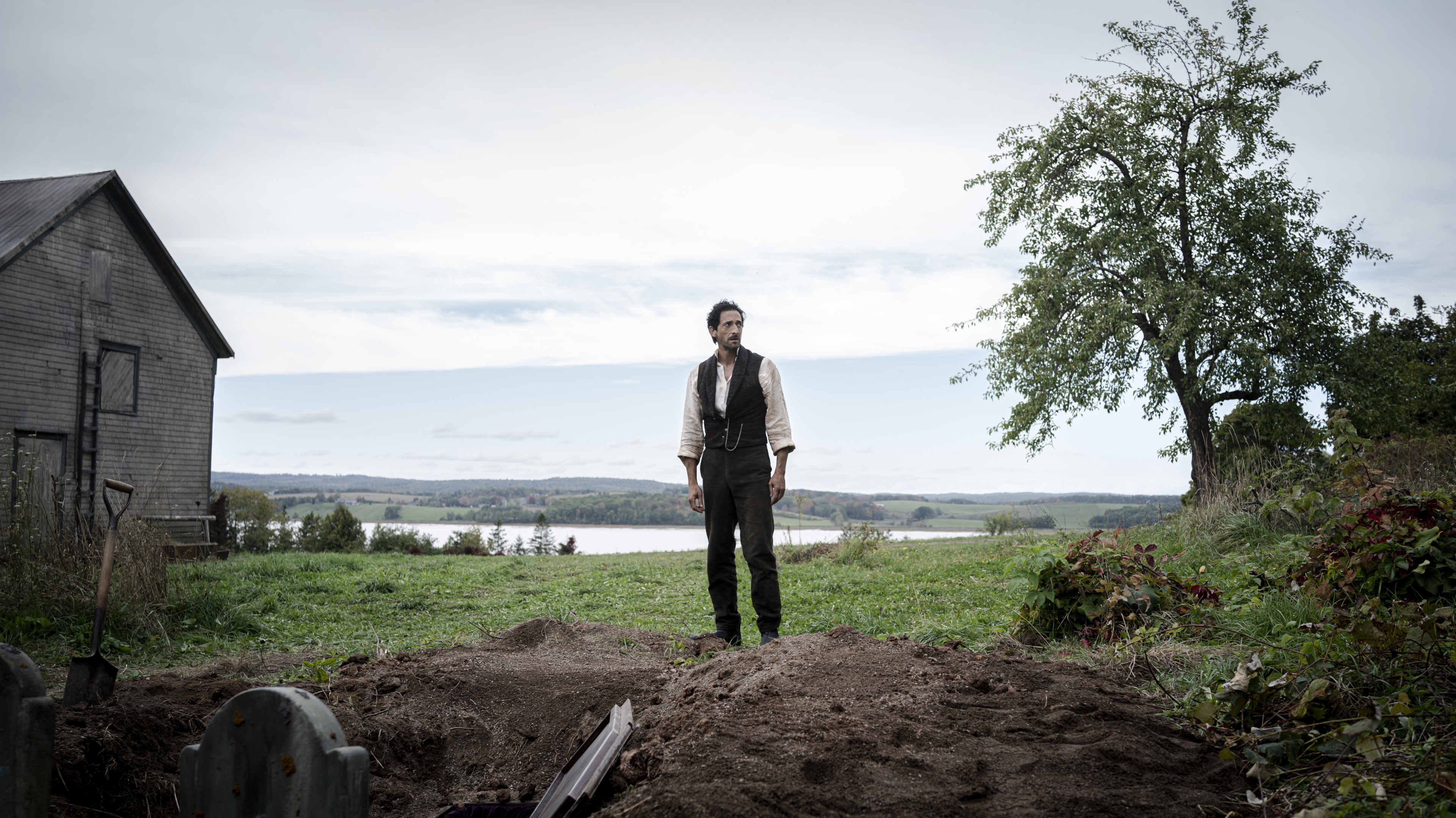 Adrien Brody standing by a grave in Chapelwaite HD Wallpaper