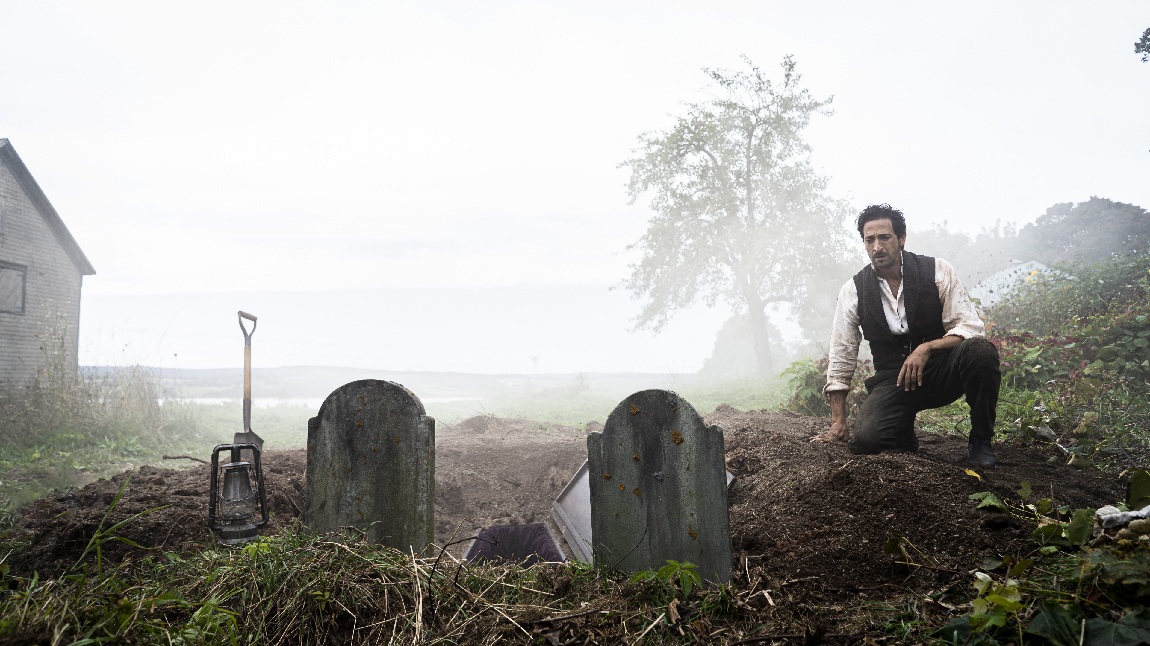 Adrien Brody kneeling at a grave in Chapelwaite HD Wallpaper
