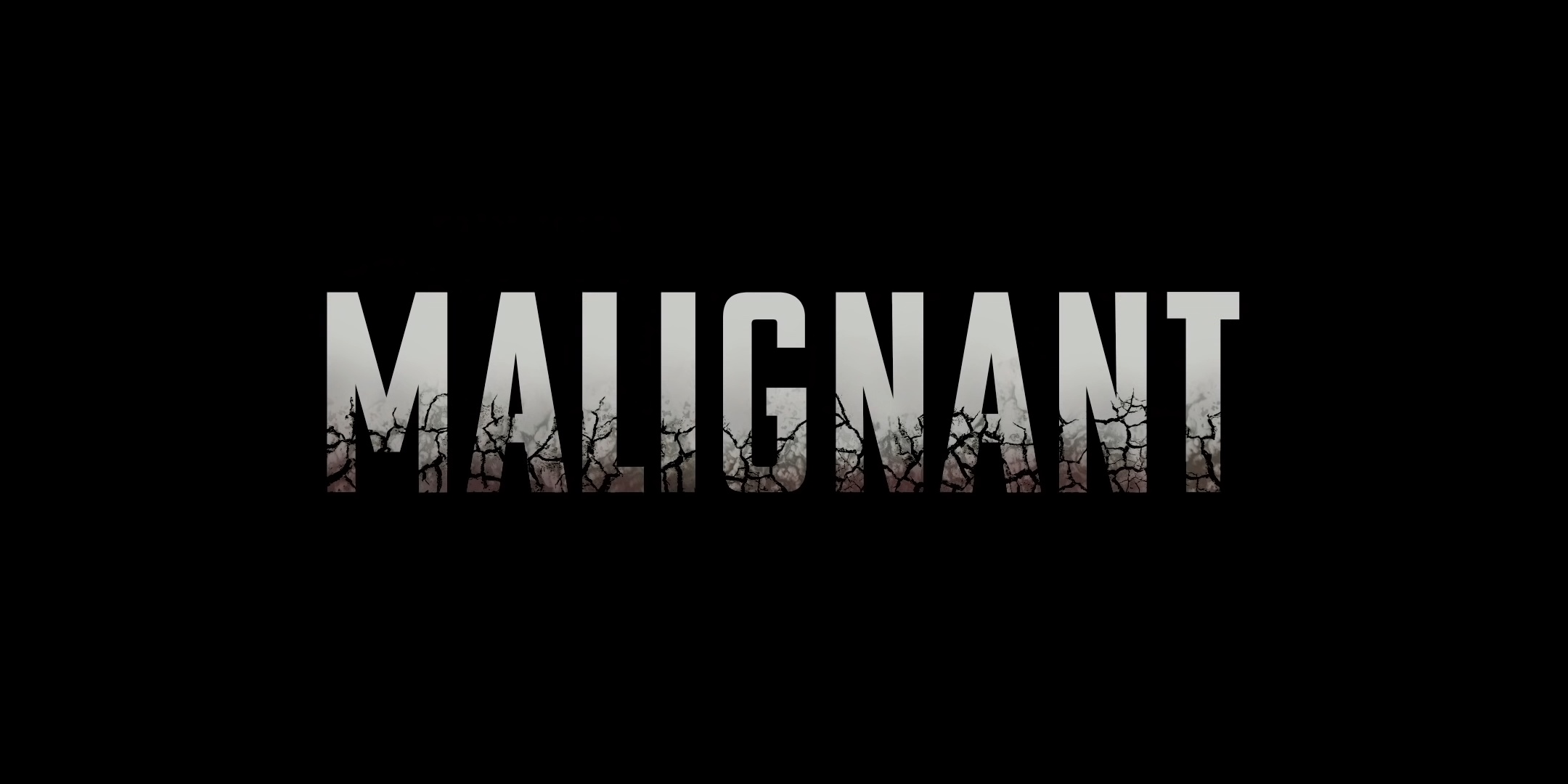 Malignant movie title with cracked texture HD Wallpaper