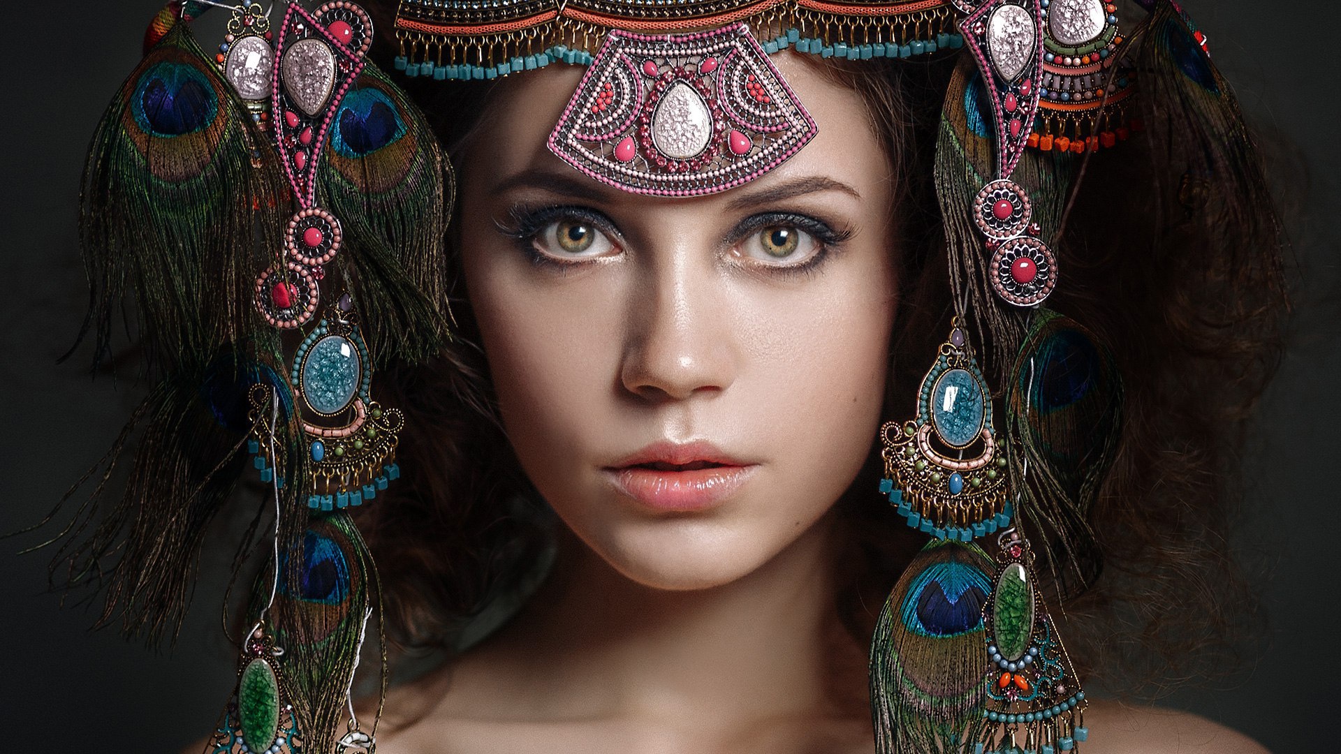 Kseniya Kokoreva wearing an elaborate peacock feather headdress HD Wallpaper