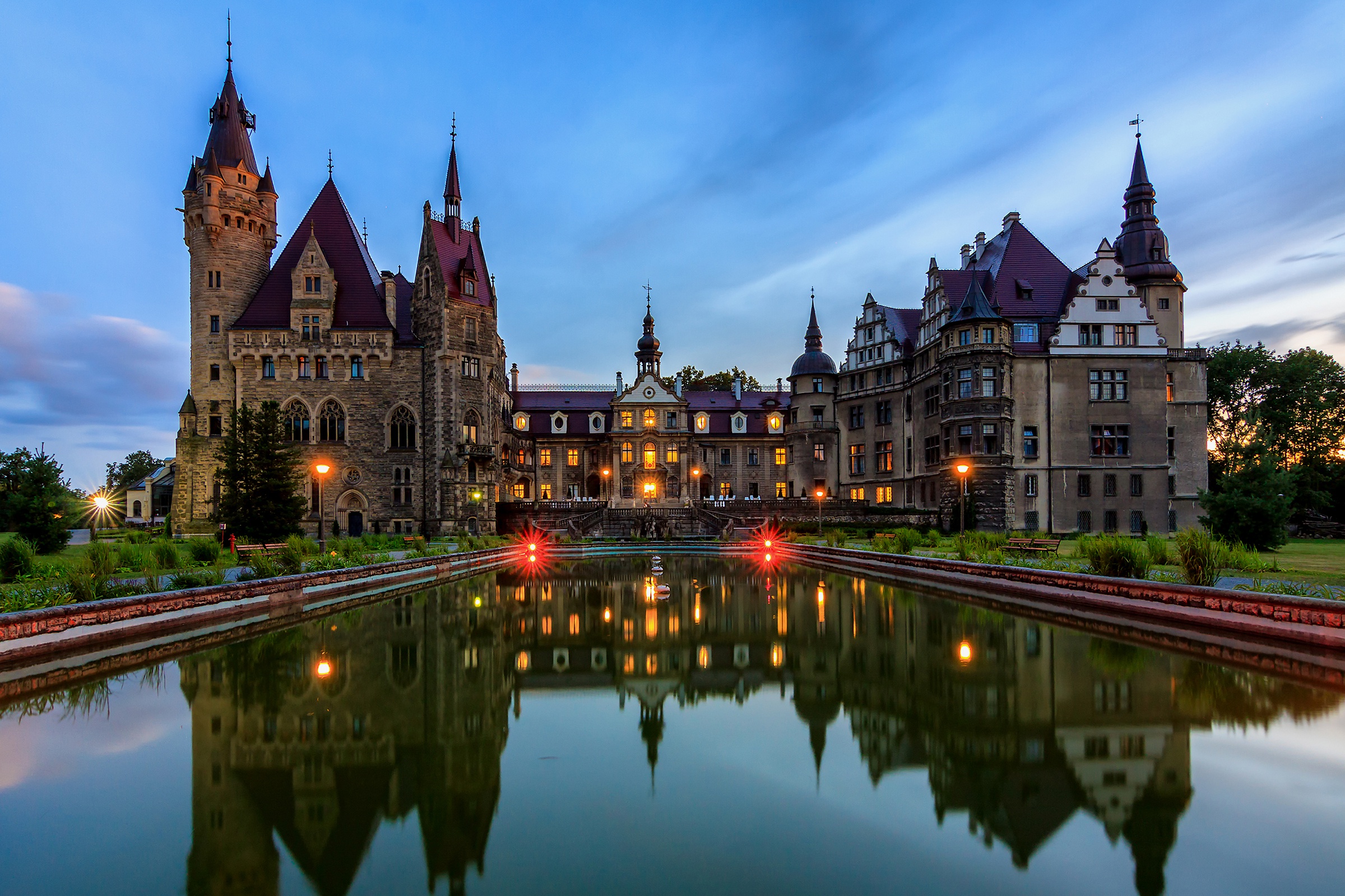 Moszna Castle: A fairytale reflection at twilight HD Wallpaper