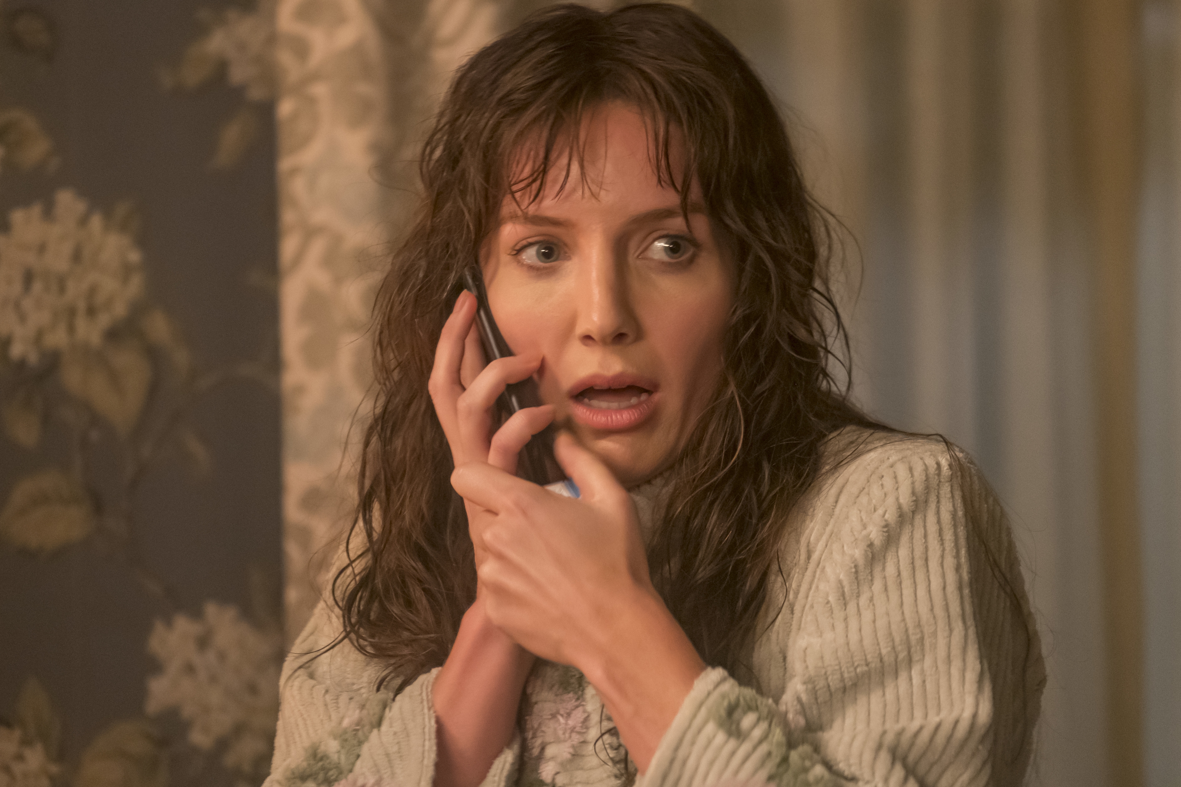 Annabelle Wallis looking shocked on the phone HD Wallpaper