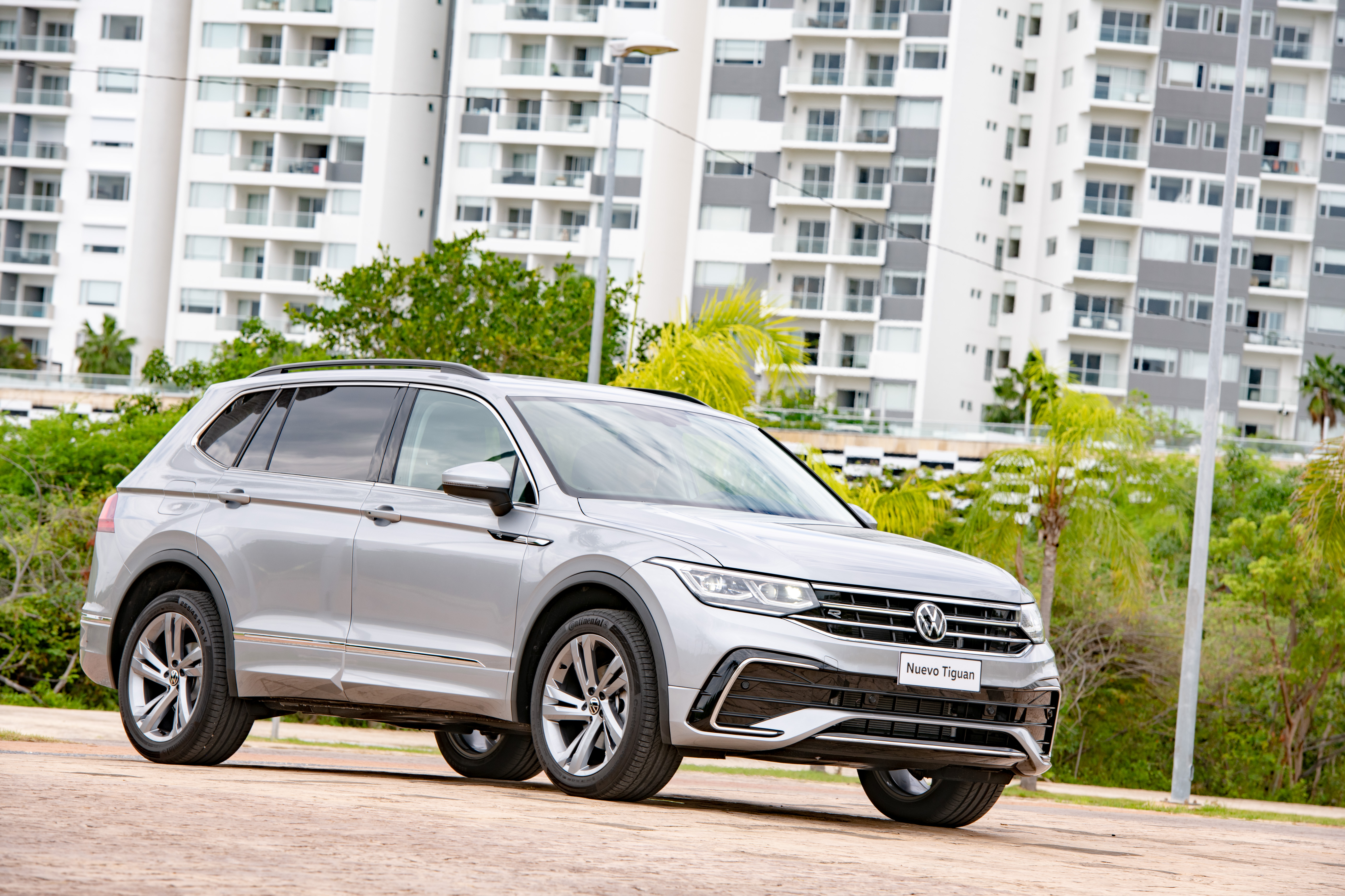 New Silver Volkswagen Tiguan SUV in urban setting HD Wallpaper