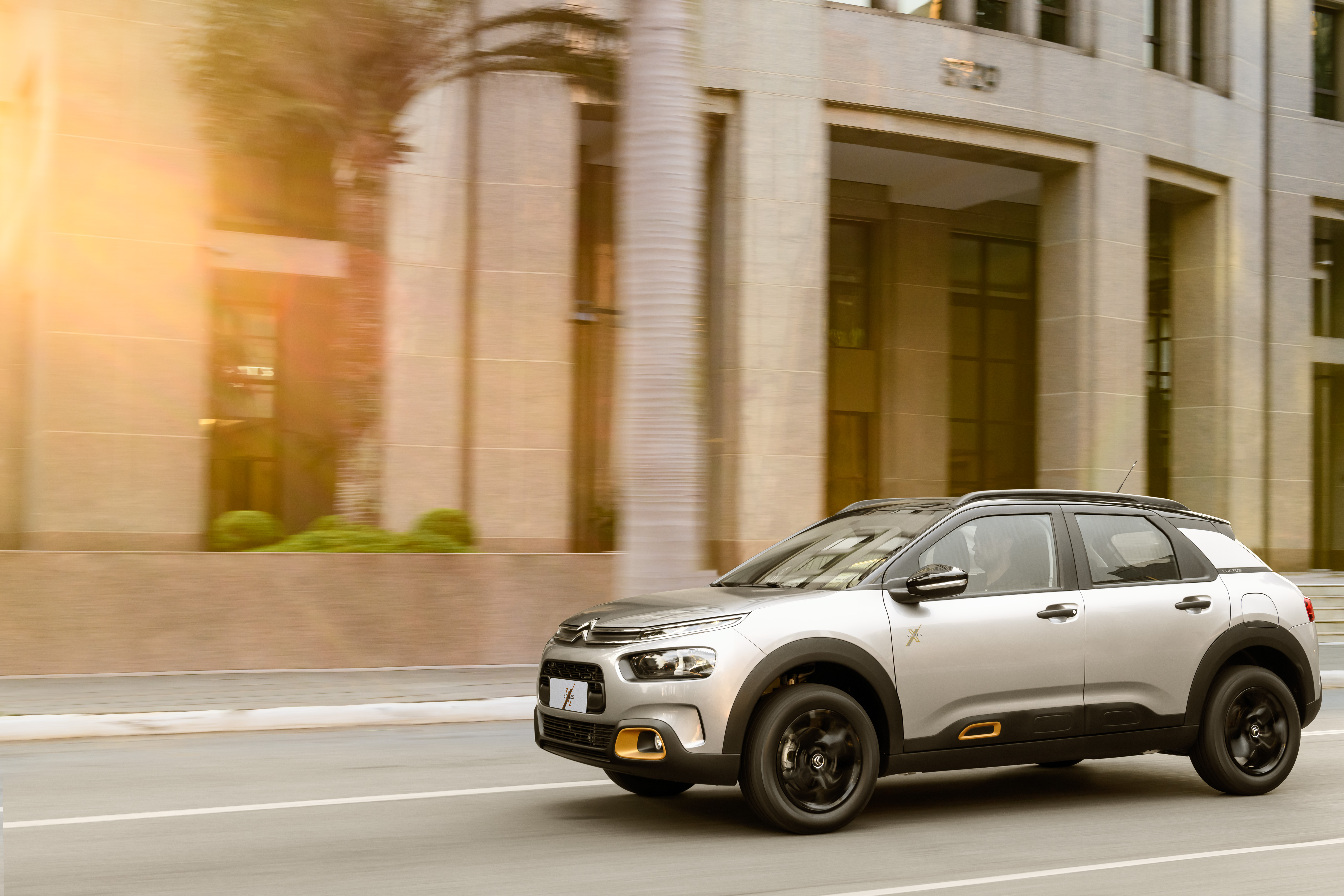 Citroën C4 Cactus X-Series SUV driving on street HD Wallpaper
