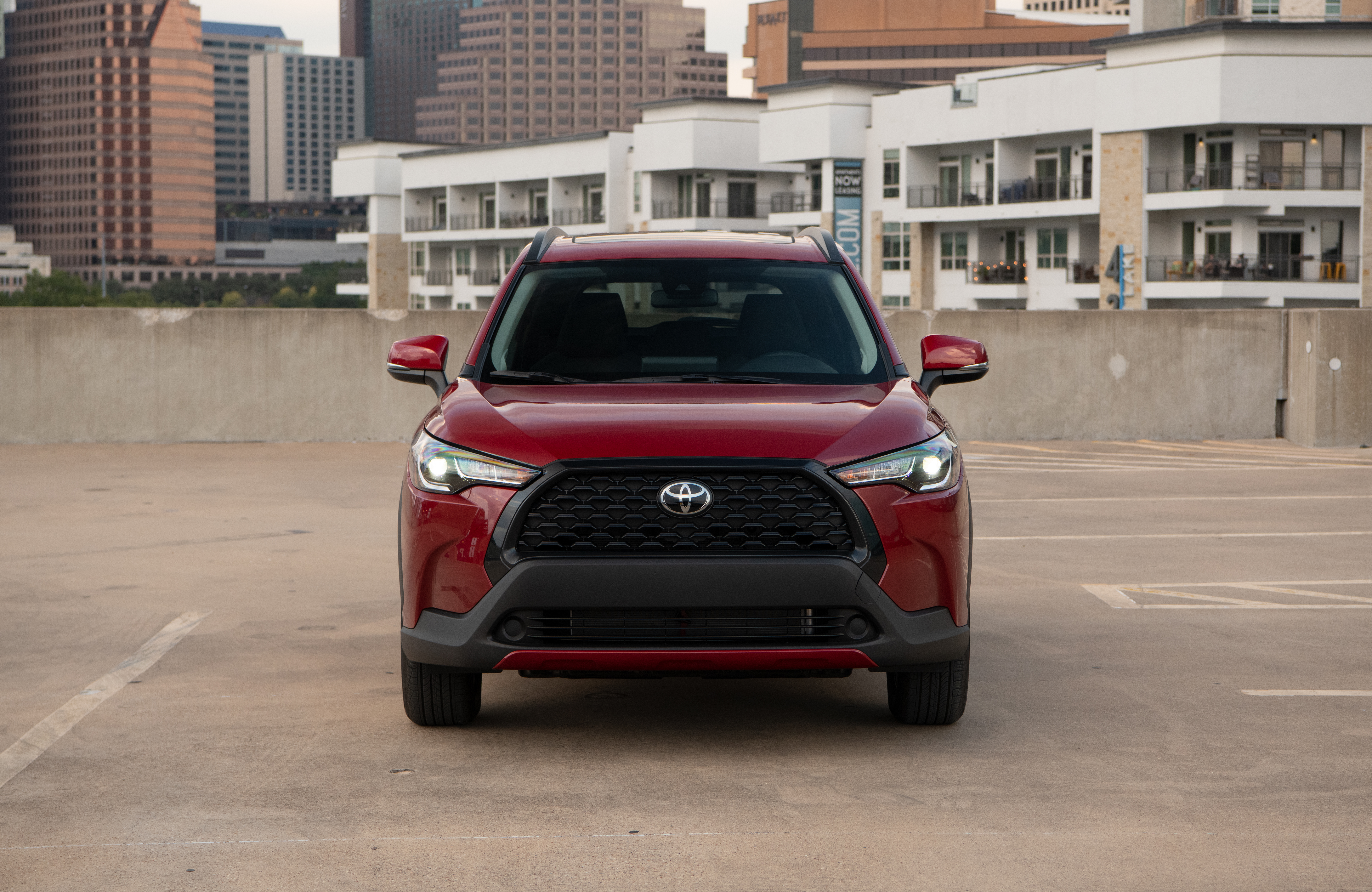 Red Toyota Corolla Cross 4K SUV in city HD Wallpaper