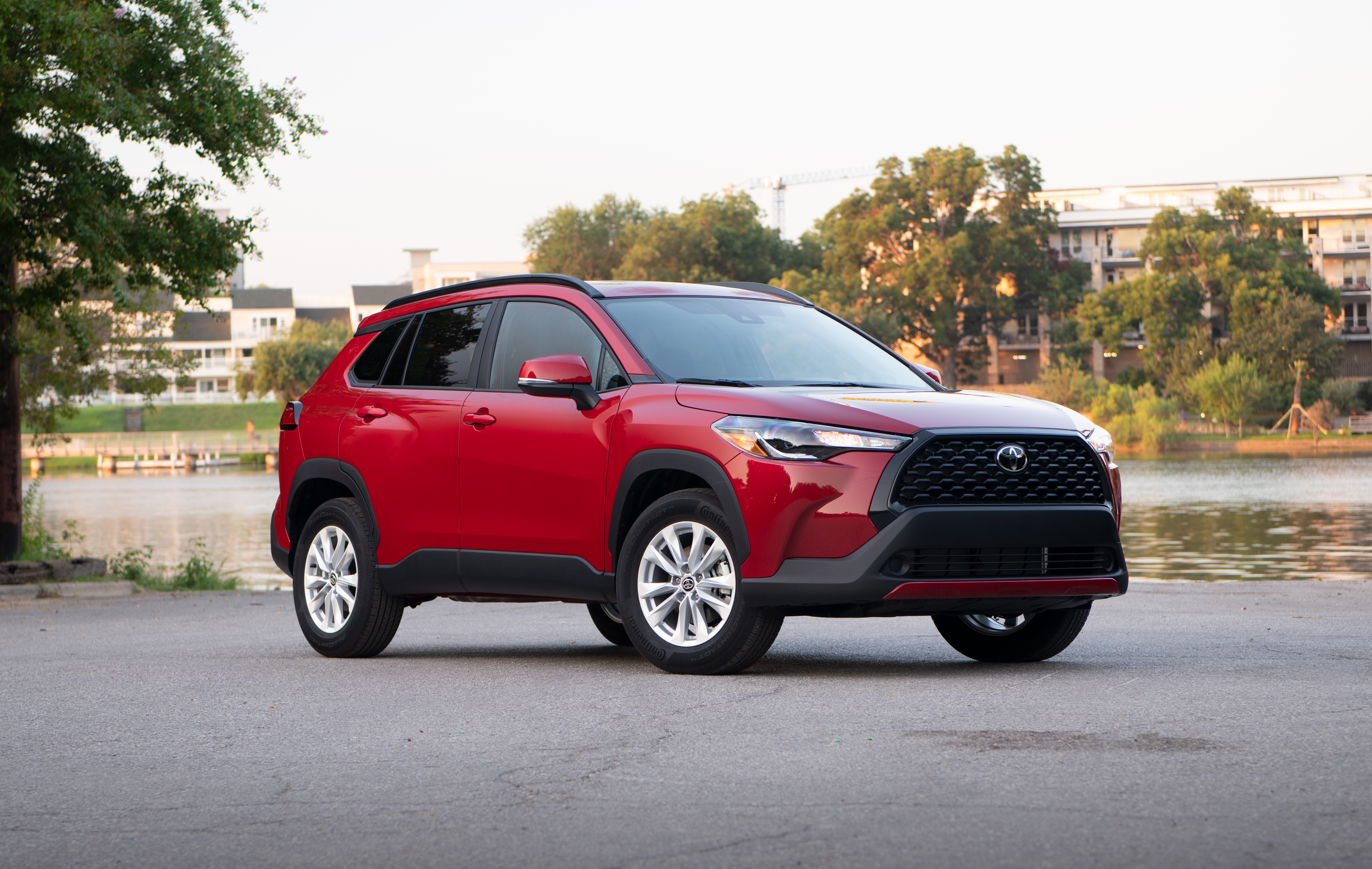 Red Toyota Corolla Cross SUV by the water HD Wallpaper