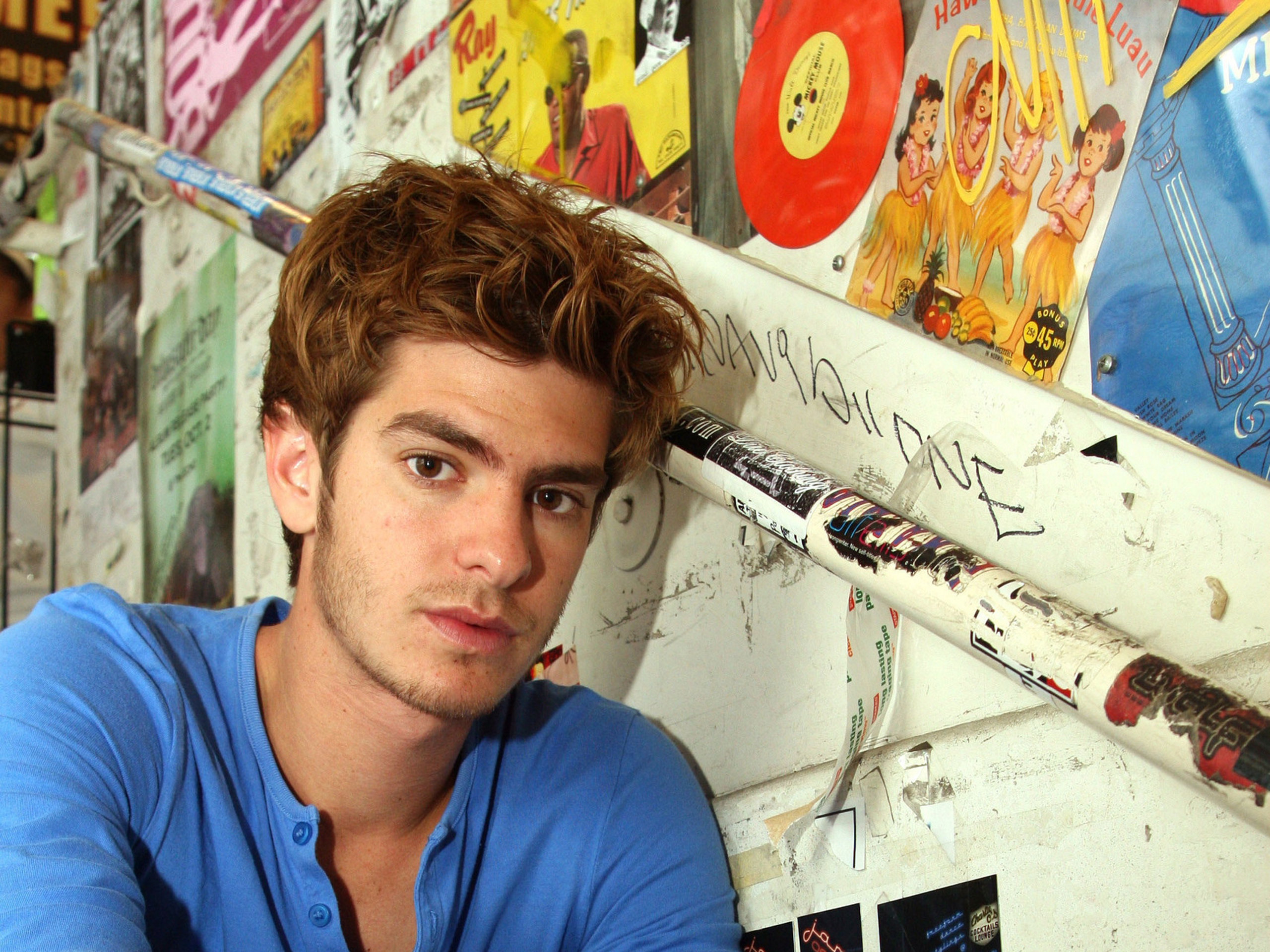 Andrew Garfield posing in blue shirt indoors HD Wallpaper