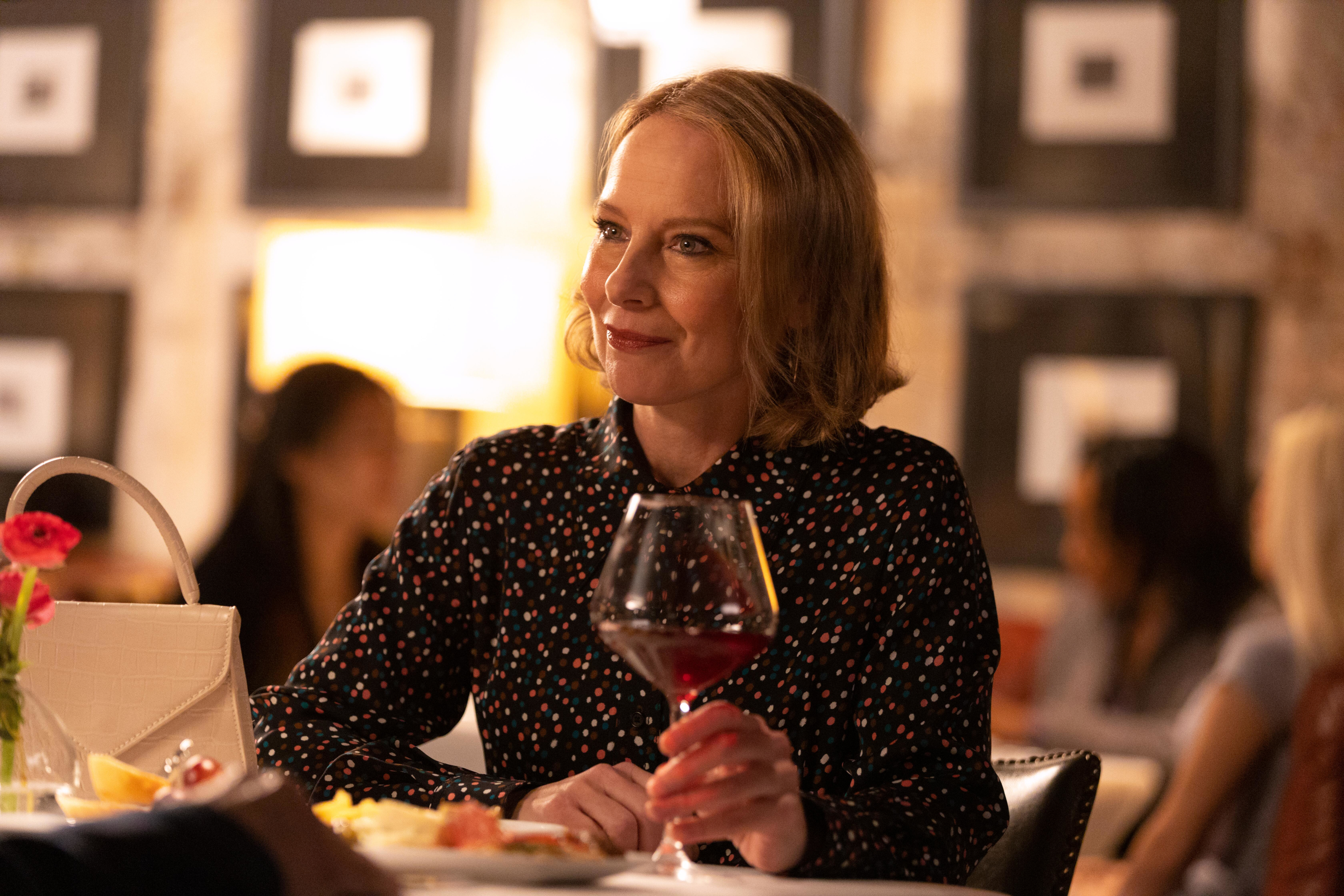 Amy Ryan smiling with red wine in Only Murders In The Building HD Wallpaper