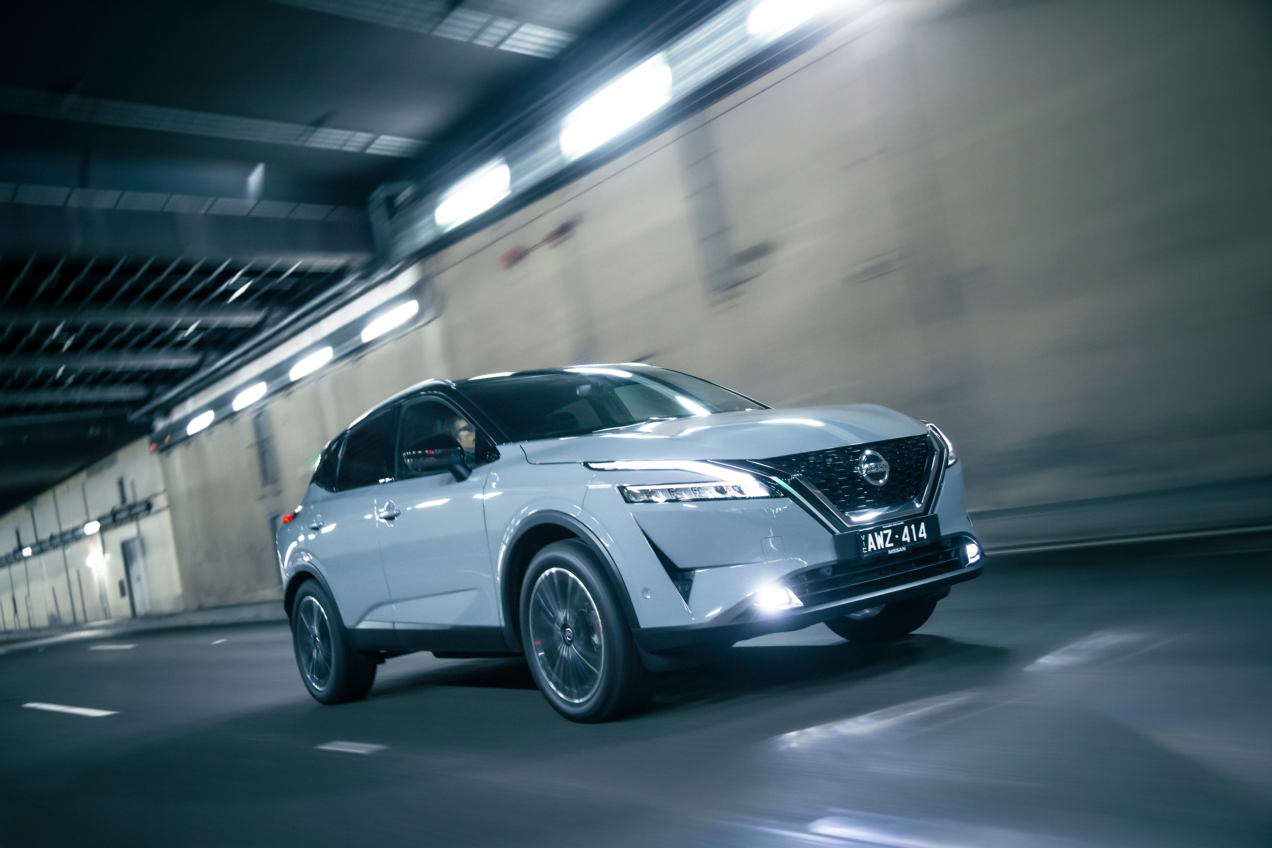 Dynamic Nissan Qashqai SUV driving in tunnel HD Wallpaper