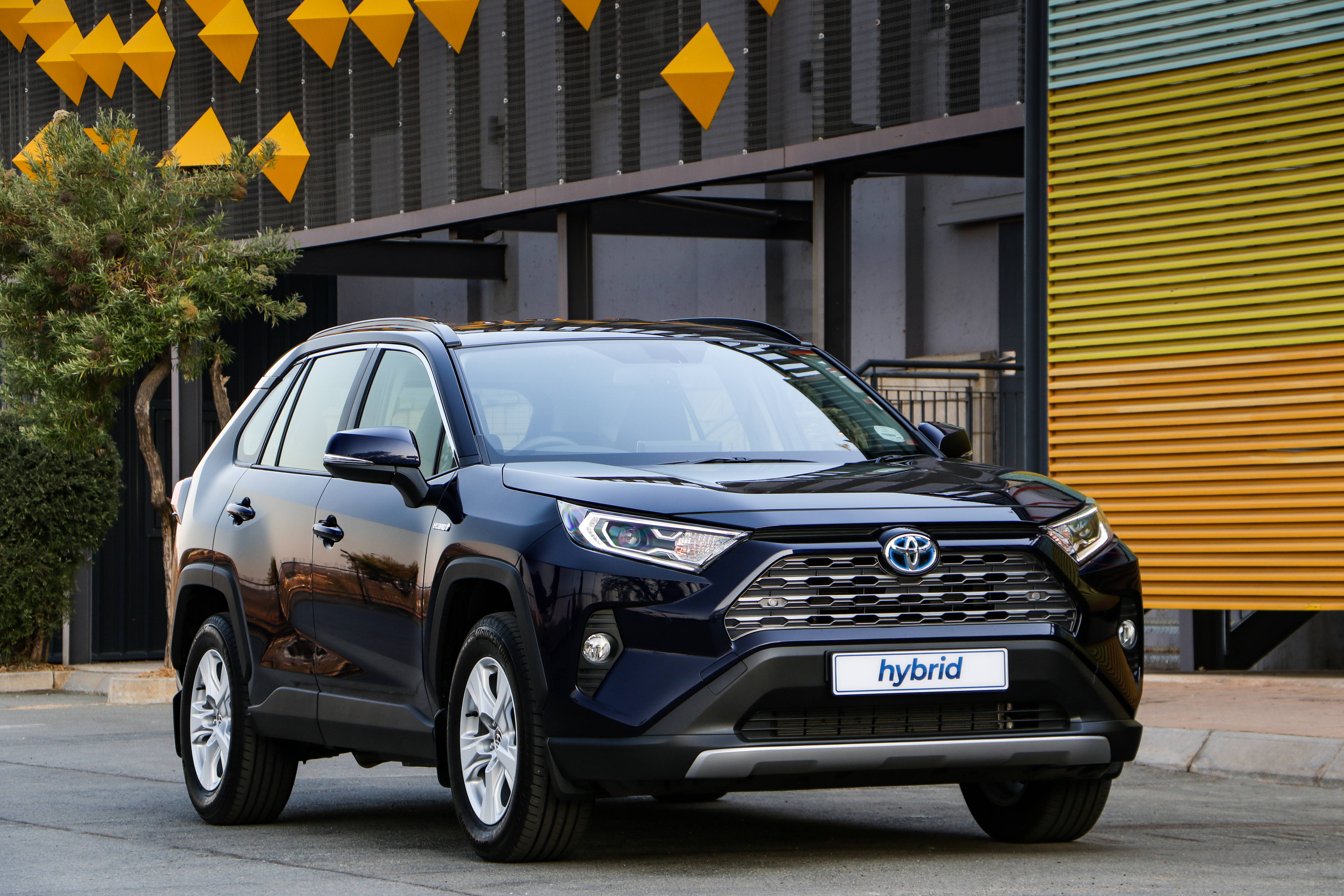 Dark Blue Toyota RAV4 Hybrid SUV on Street HD Wallpaper