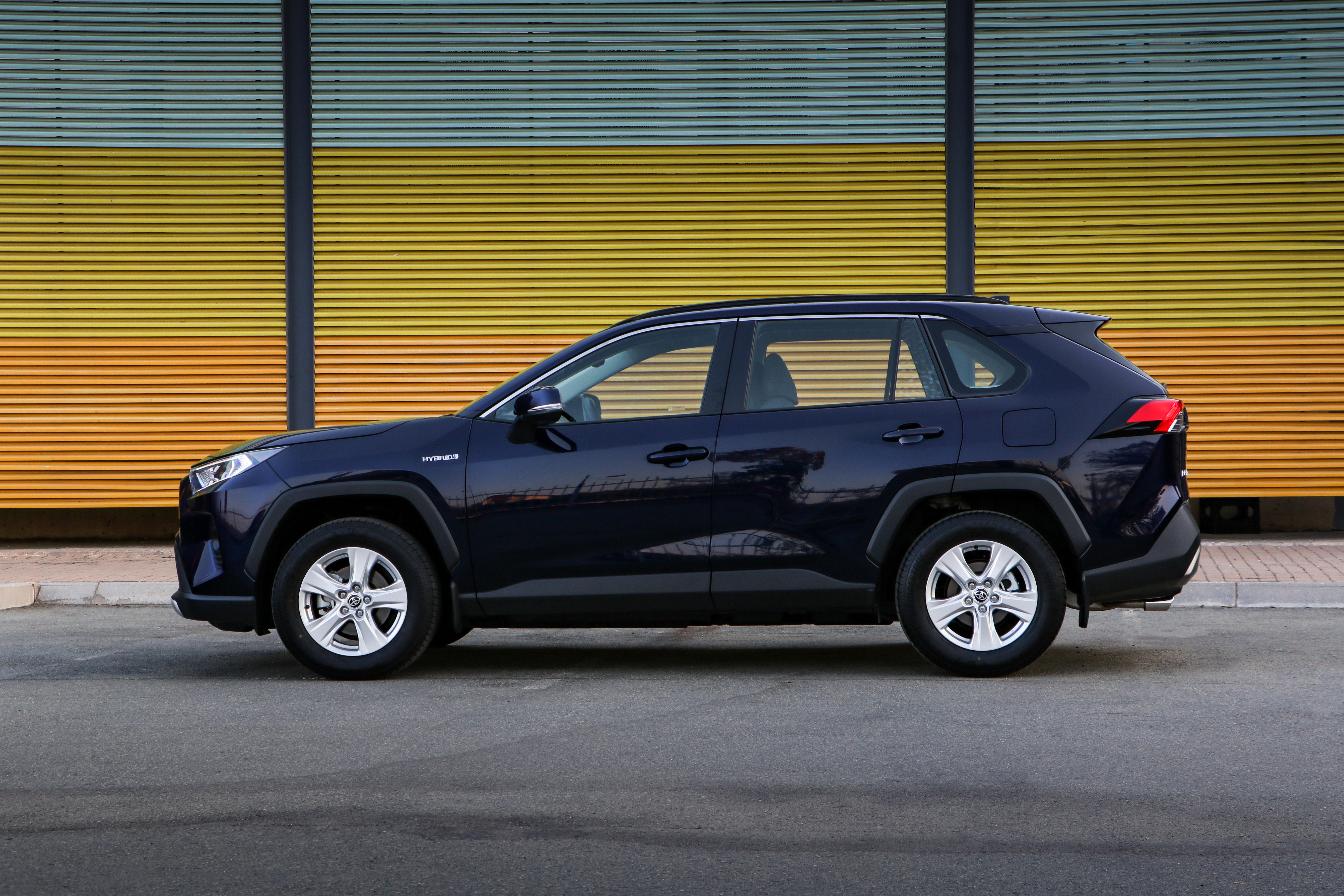 Toyota RAV4 Hybrid SUV Parked Against Striped Wall HD Wallpaper