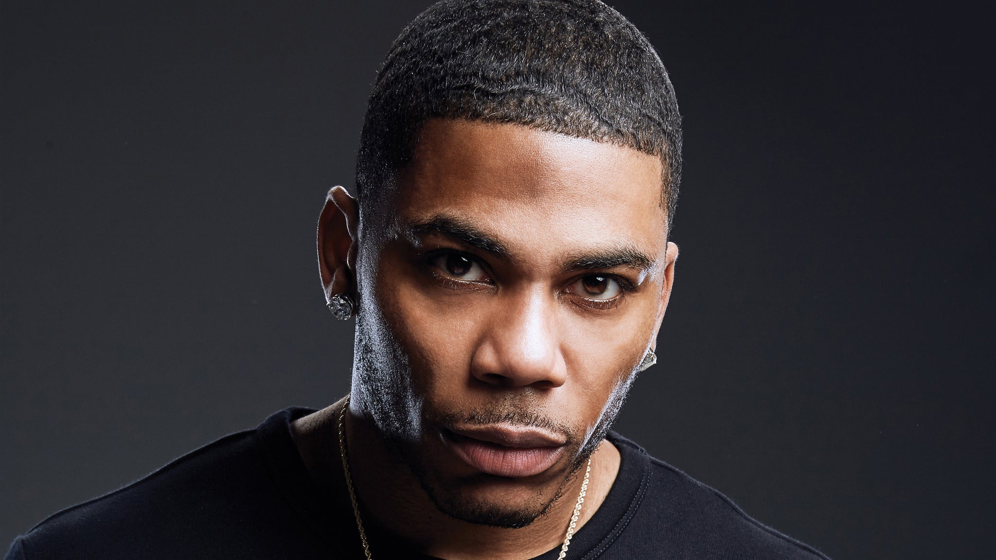 Nelly close-up portrait looking at camera HD Wallpaper