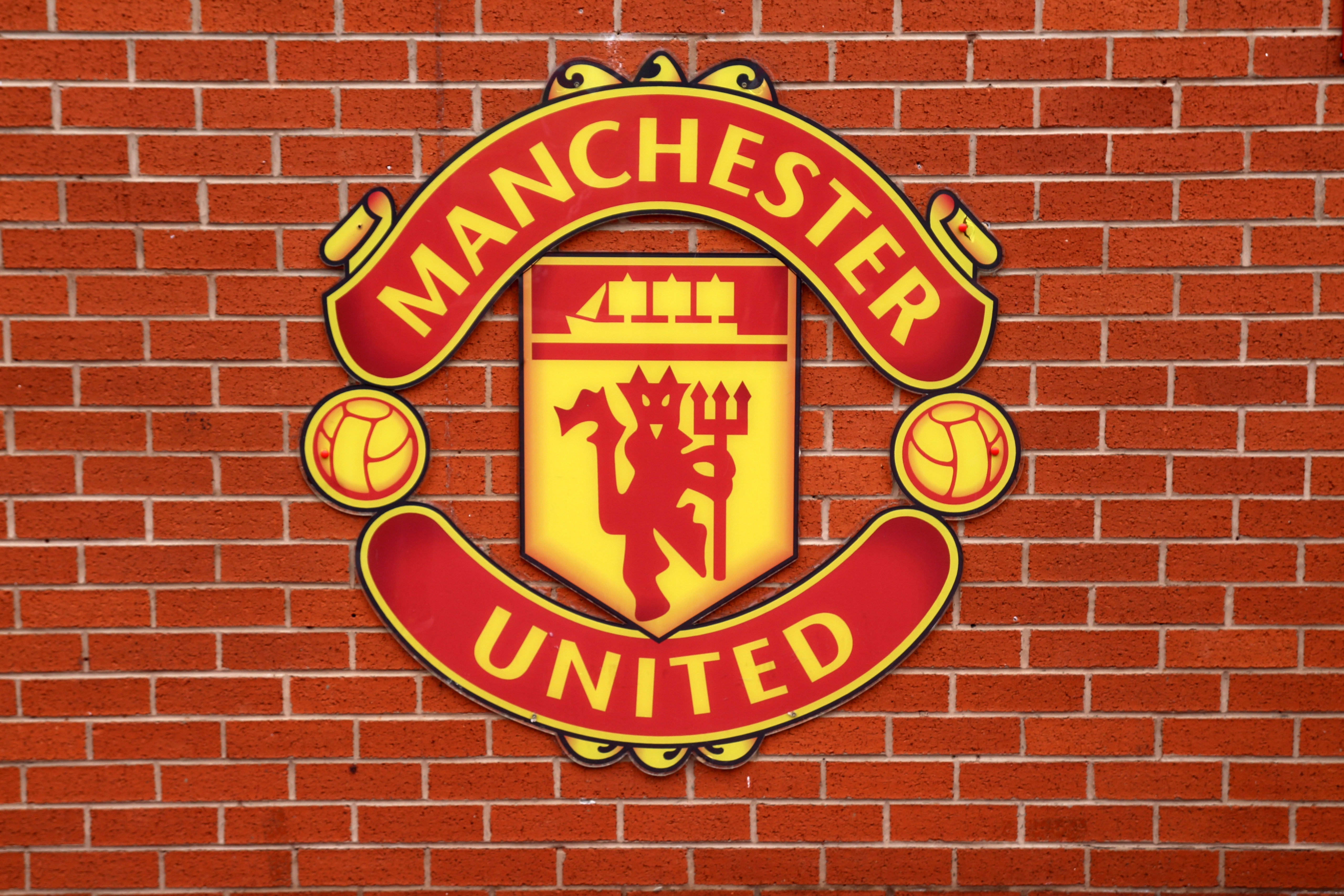 Manchester United F.C. Logo on Brick Wall HD Wallpaper