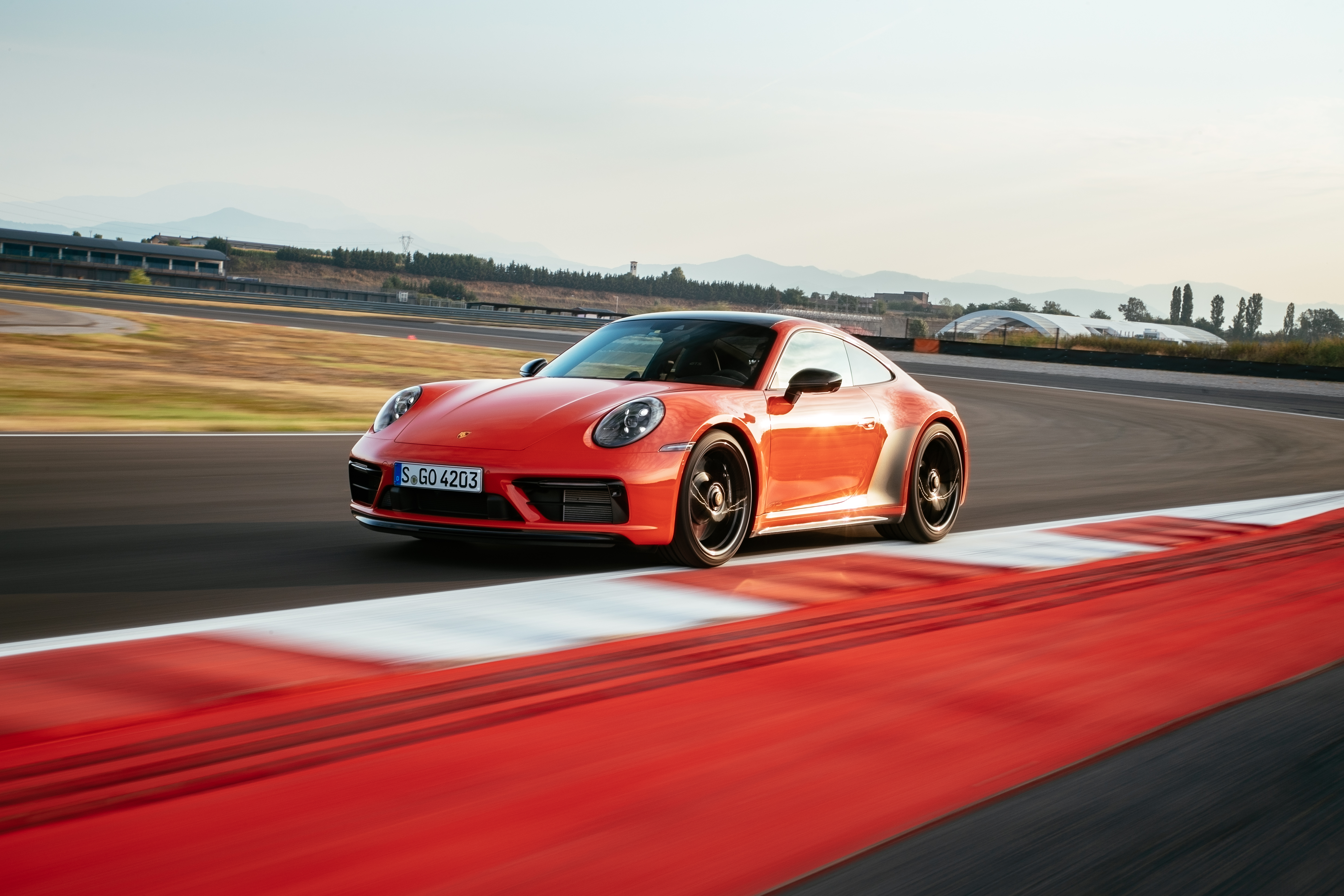 Red Porsche 911 Carrera GTS on track HD Wallpaper