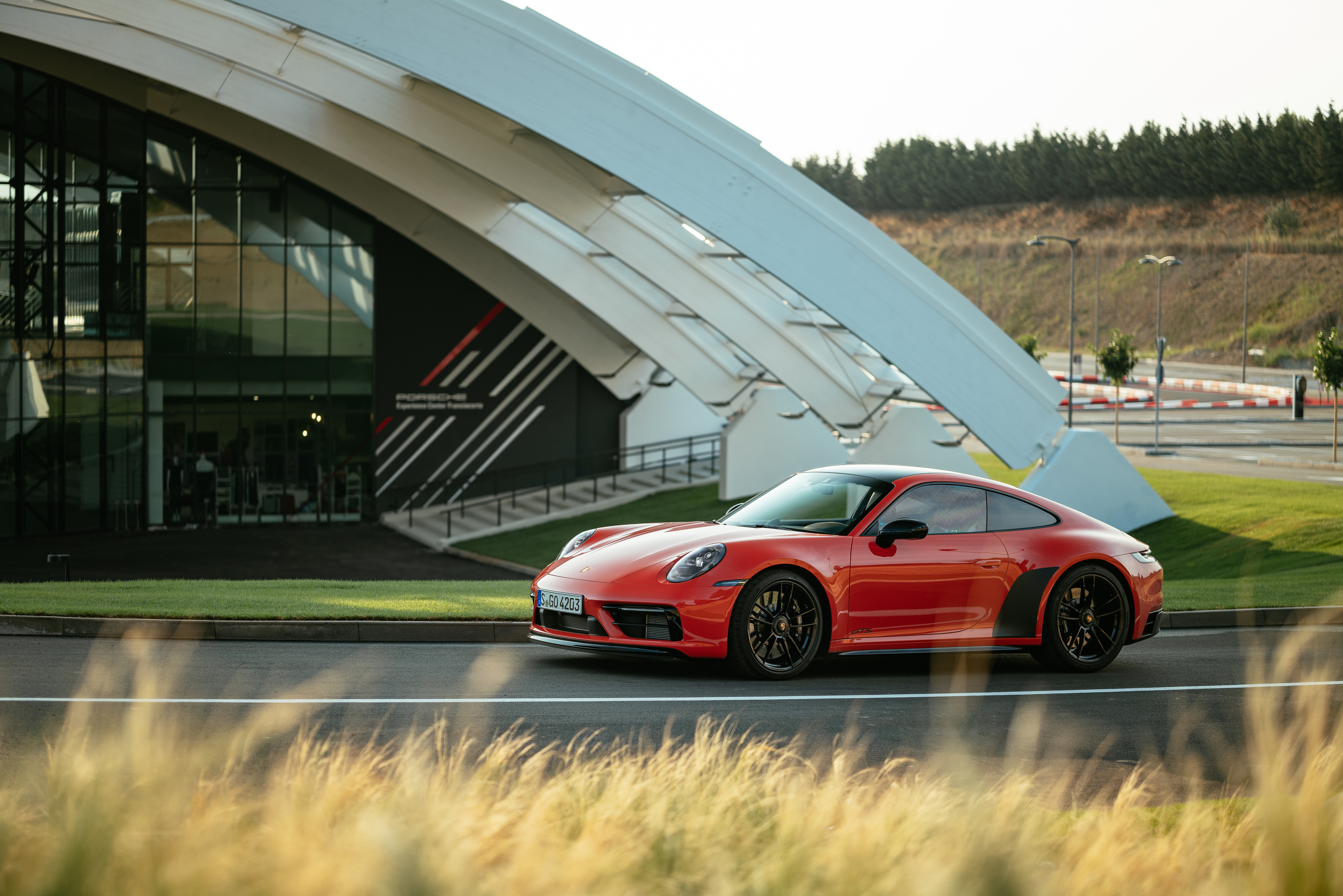 Red Porsche 911 Carrera GTS at Porsche Center HD Wallpaper
