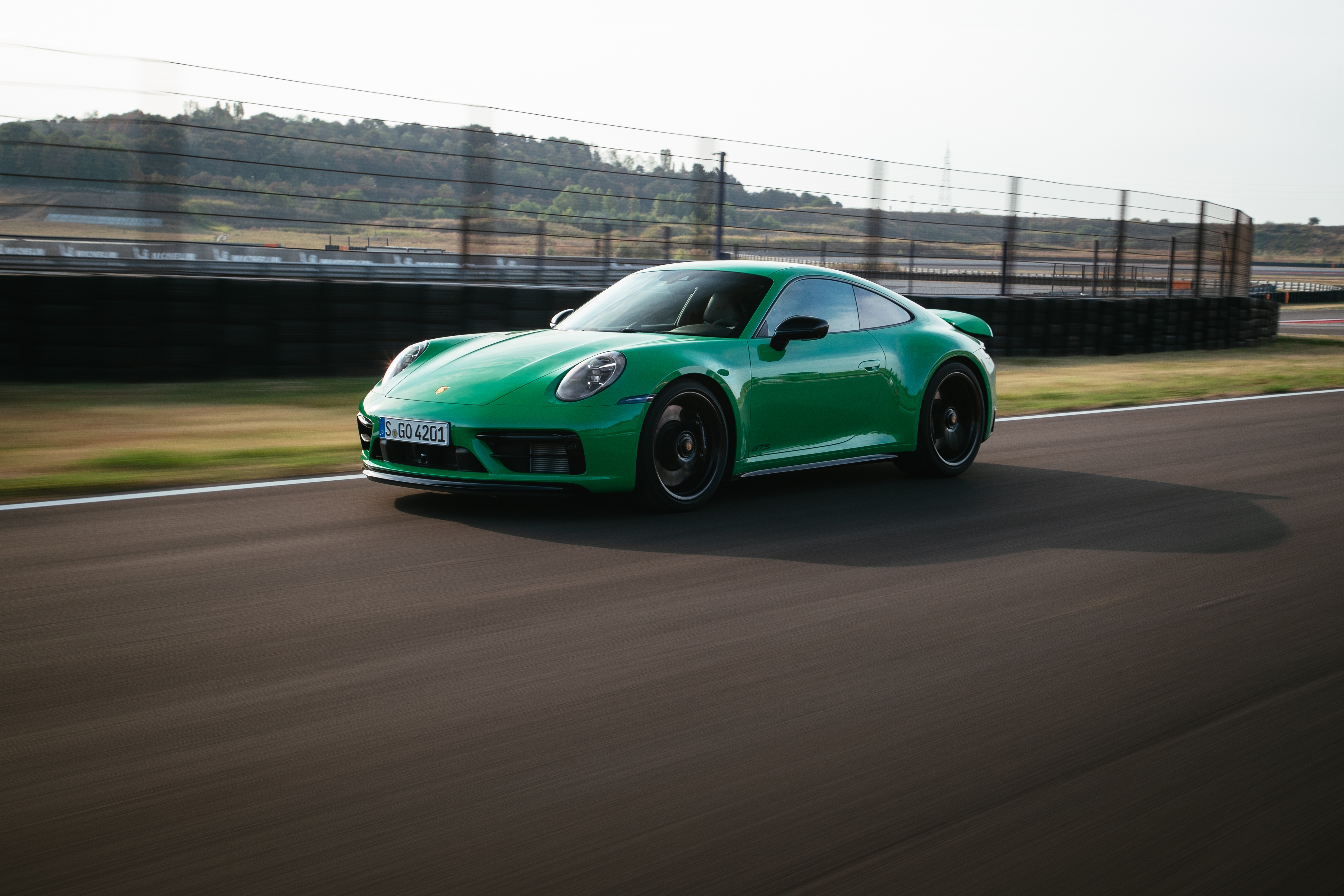 Green Porsche 911 Carrera GTS on track 4K HD Wallpaper
