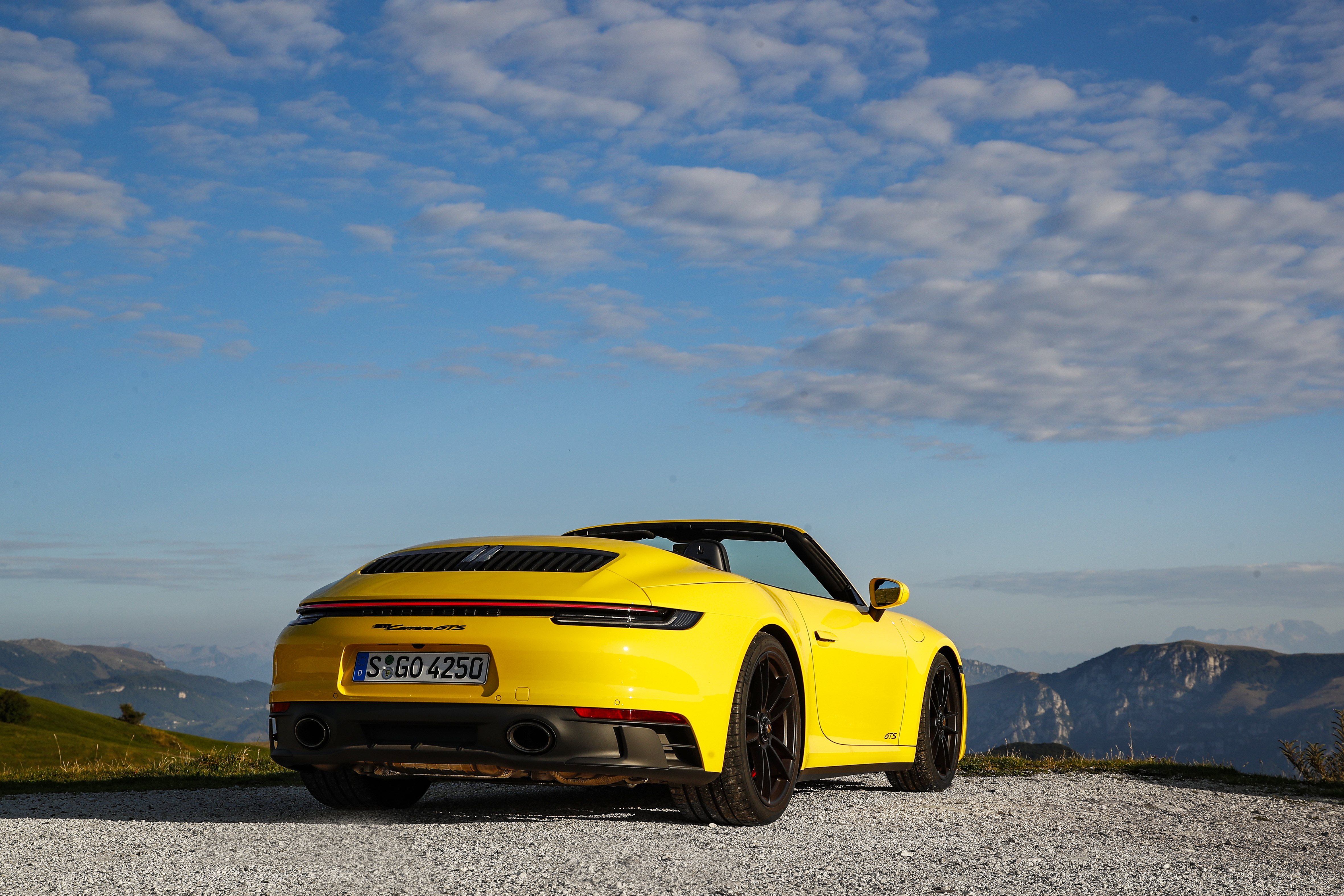Yellow Porsche 911 Carrera GTS Cabriolet in the mountains HD Wallpaper