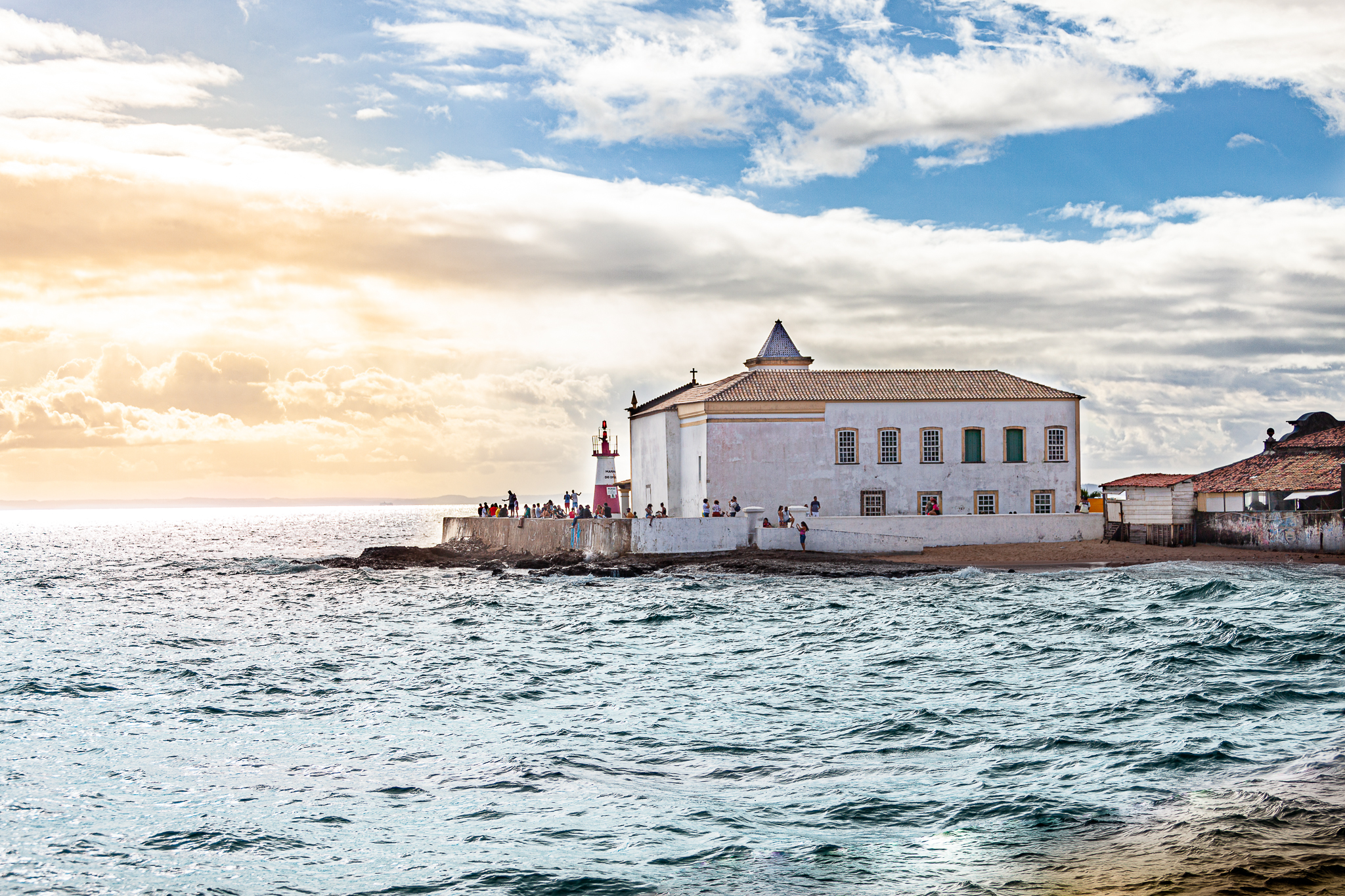 Teo Akuma: Coastal building and lighthouse at sunset HD Wallpaper