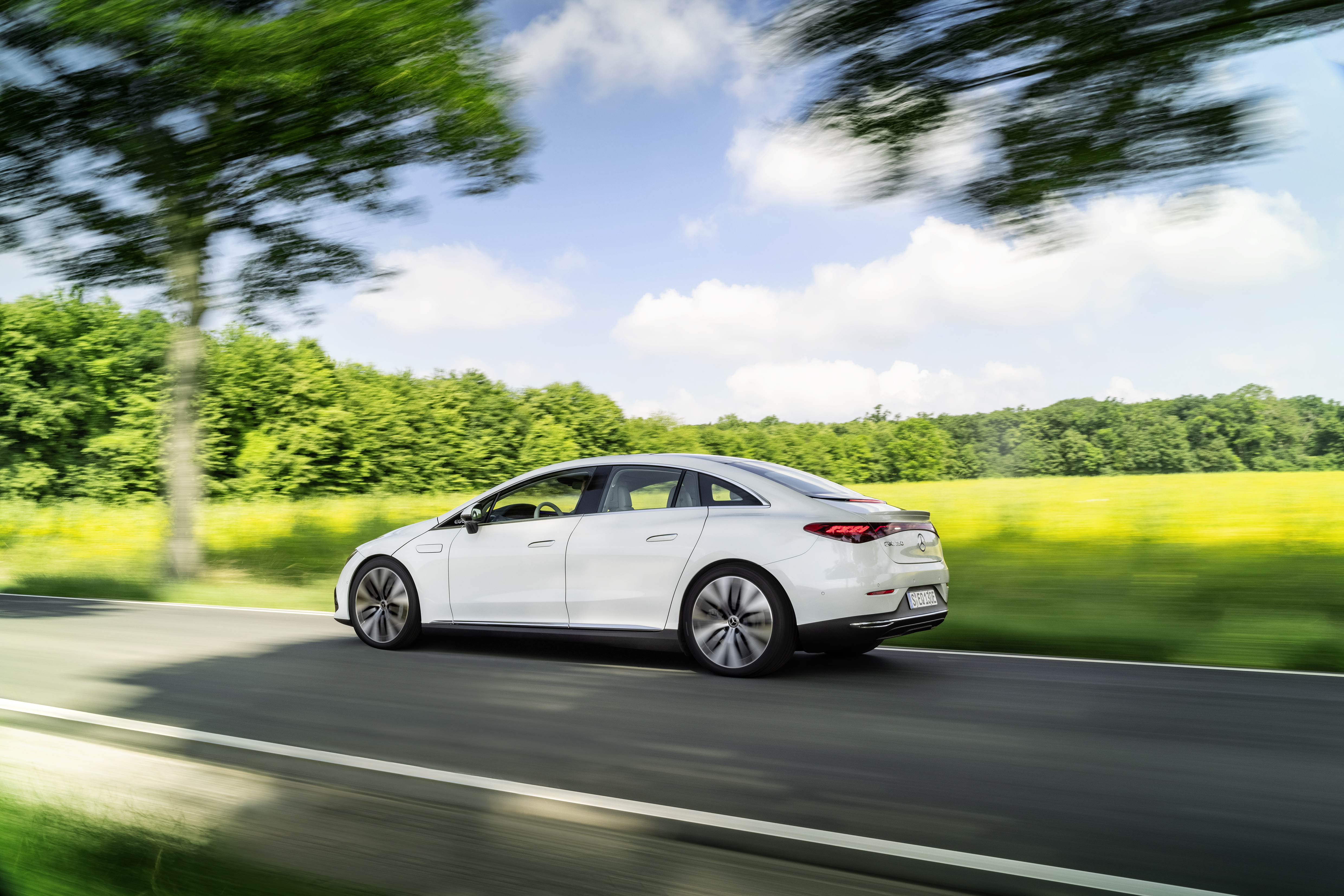Mercedes-Benz EQE 350 luxury electric car driving with motion blur. HD Wallpaper