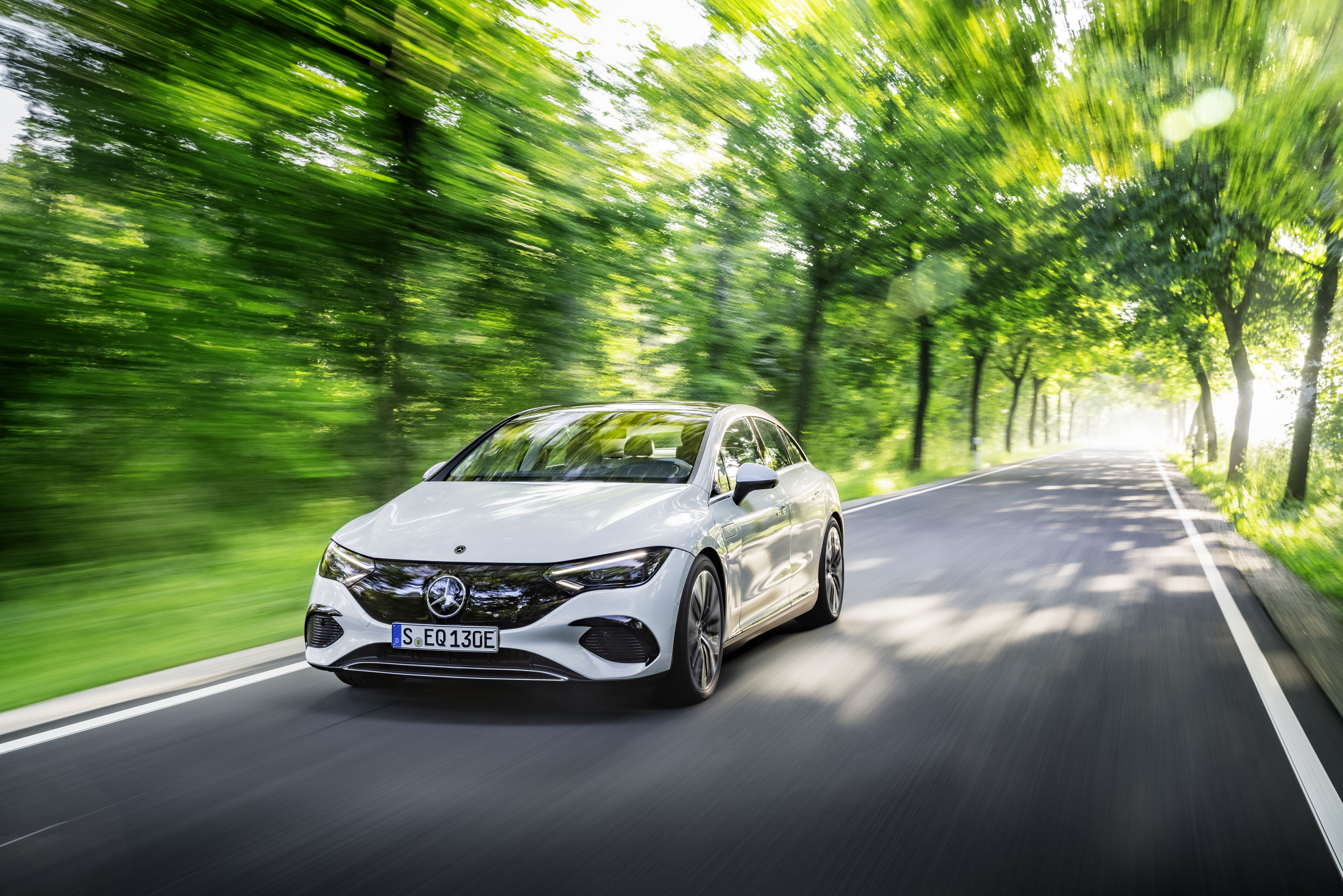 Mercedes-Benz EQE 350 Electric Car Speeding Through Green Tunnel HD Wallpaper