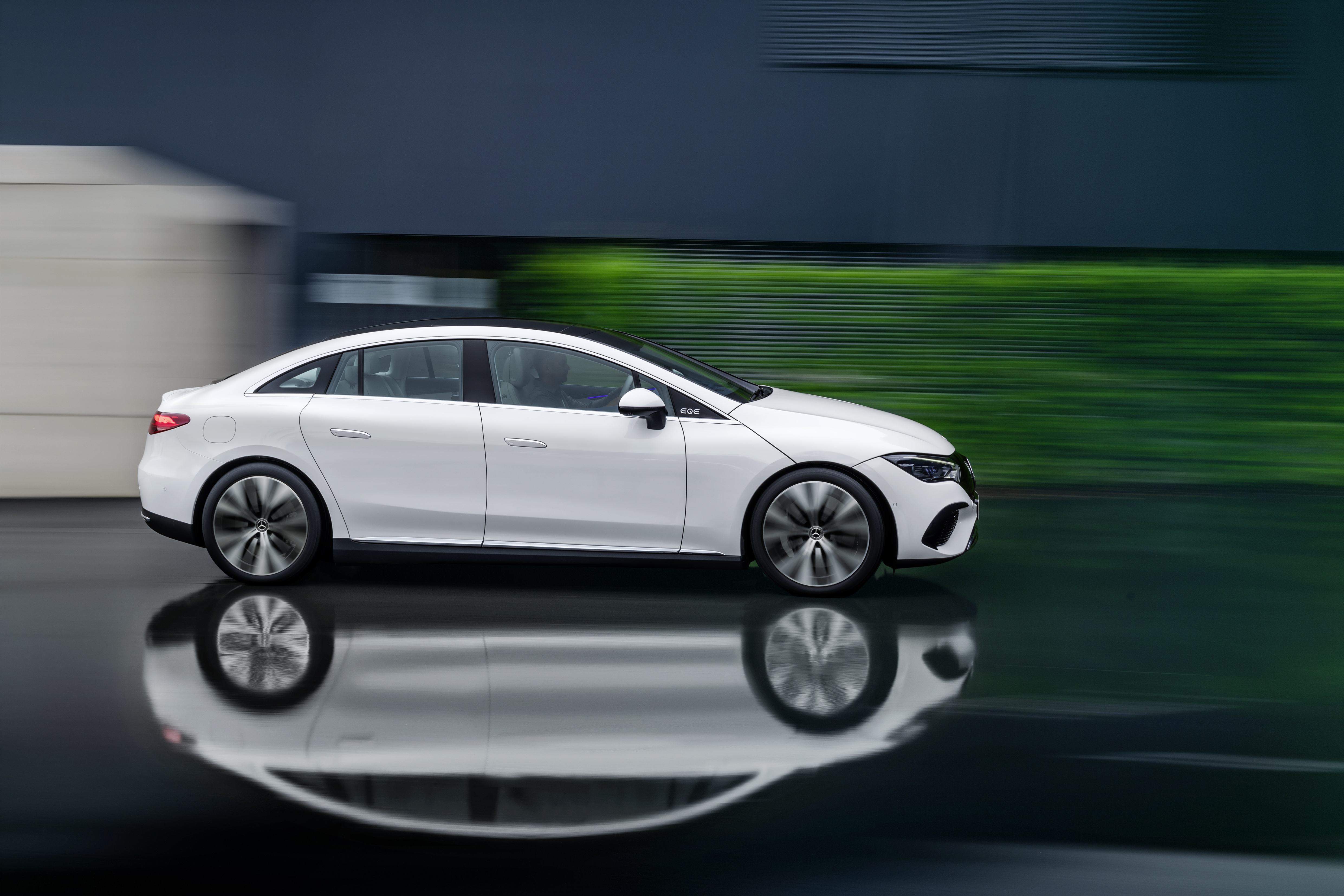 White Mercedes-Benz EQE 350 Electric Art Line driving HD Wallpaper