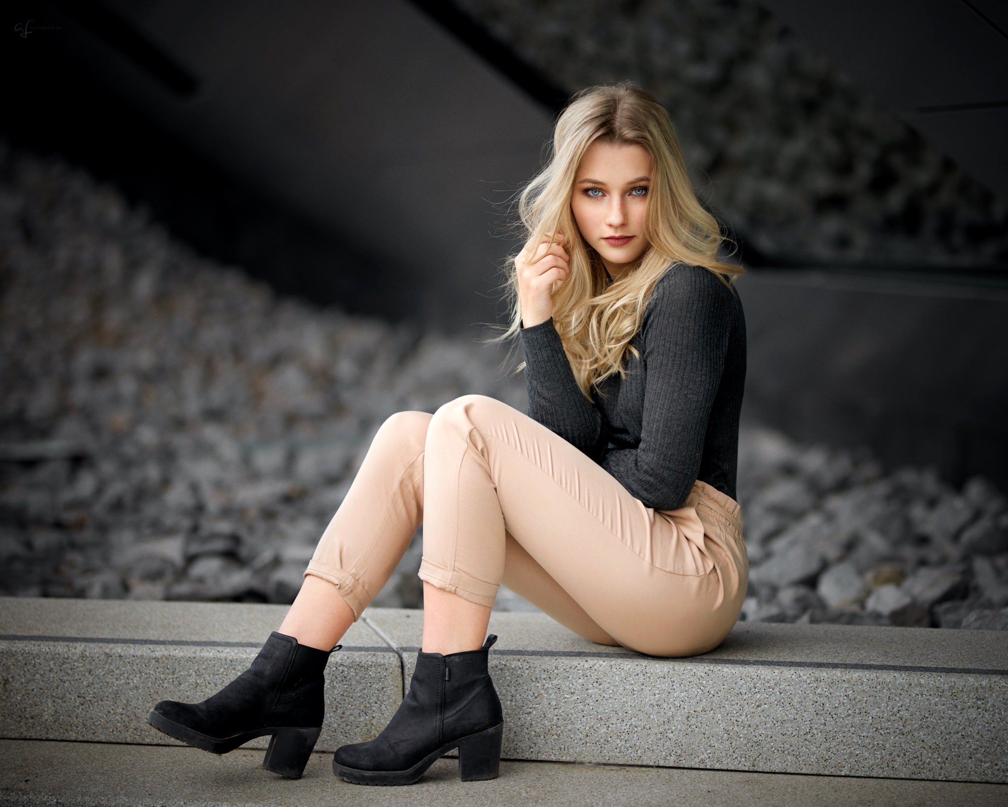 Blonde Model Sitting on Concrete Bench HD Wallpaper